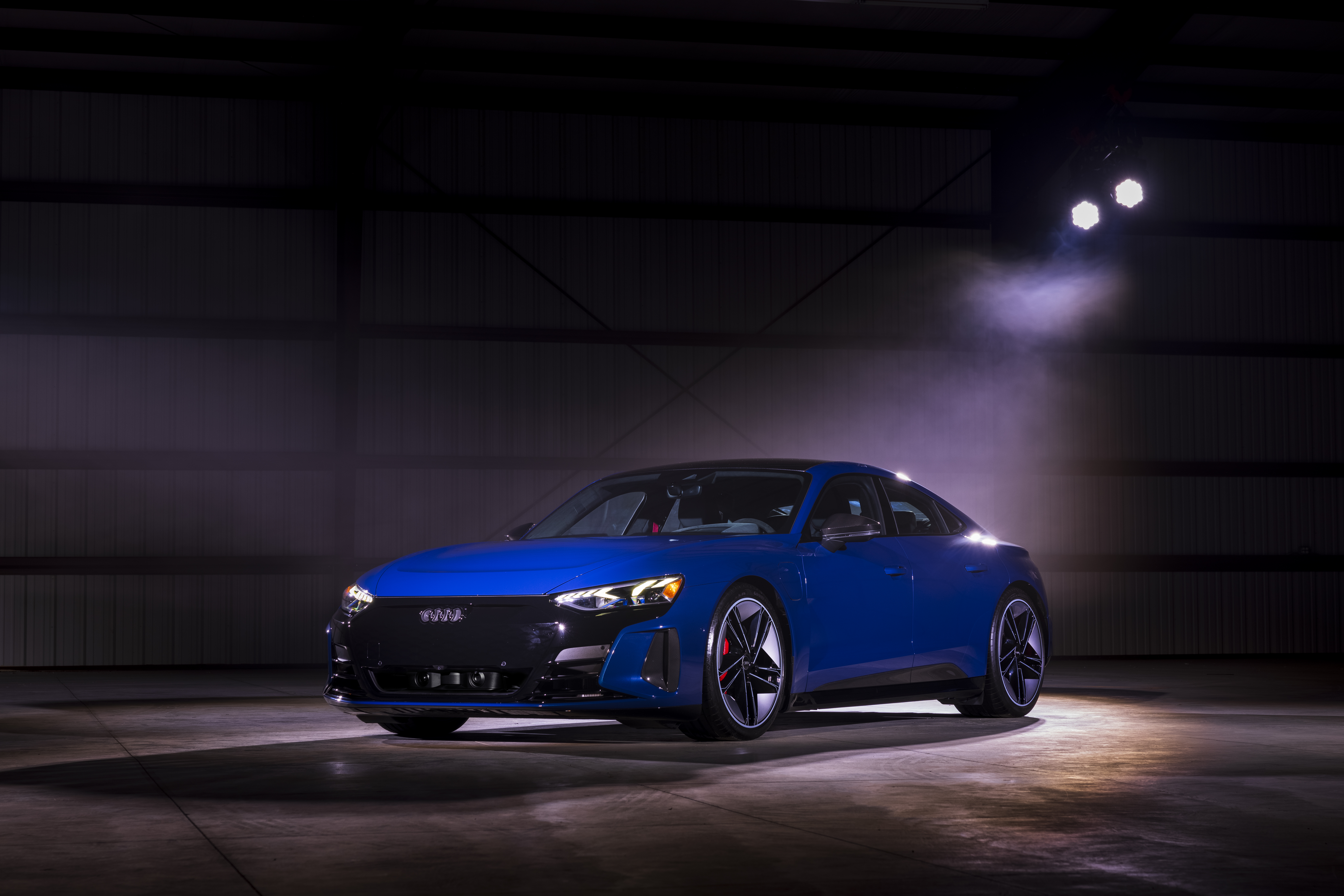 Blue Audi e-tron GT Quattro electric car under spotlights HD Wallpaper