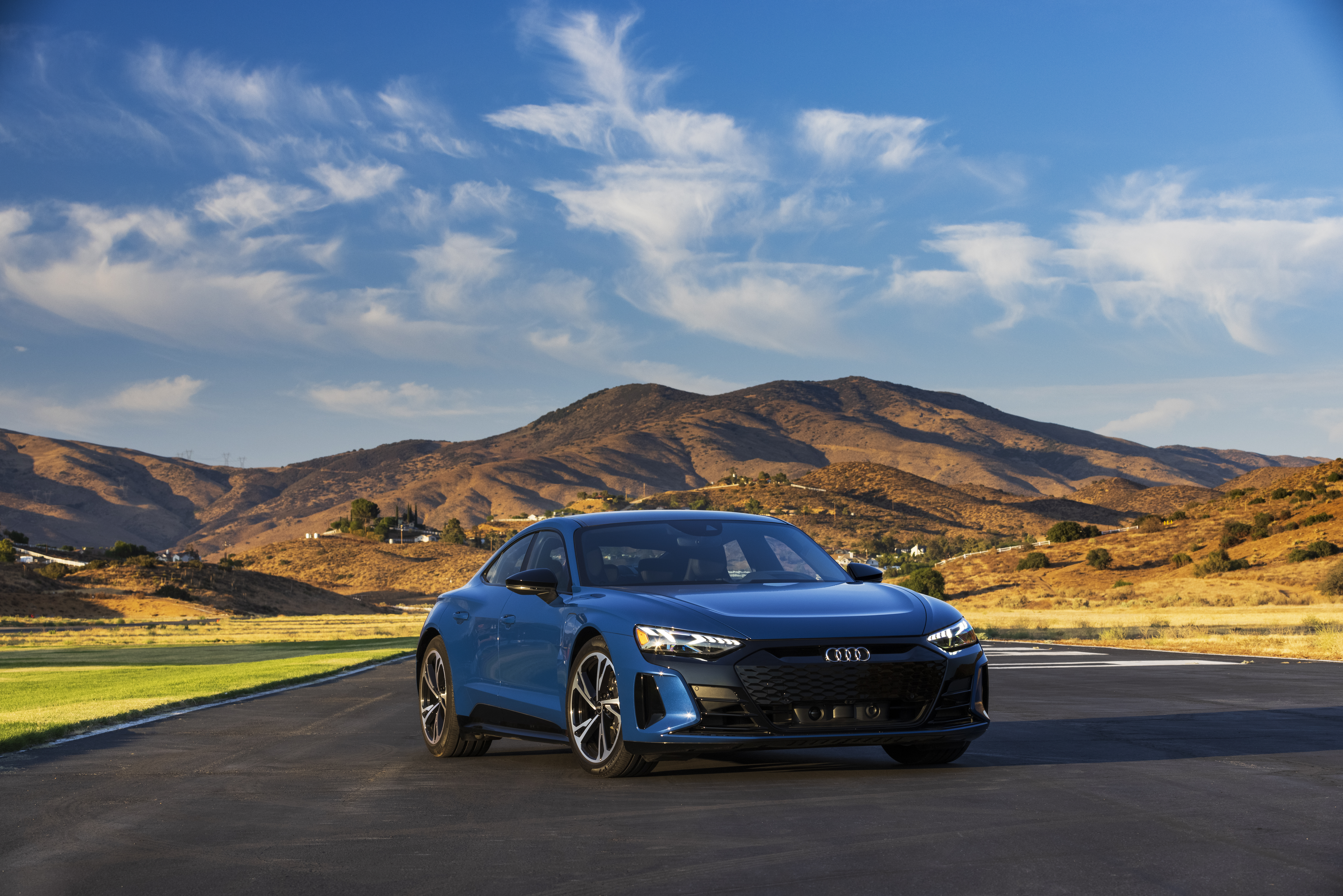 Blue Audi e-tron GT Quattro electric car in mountain landscape HD Wallpaper