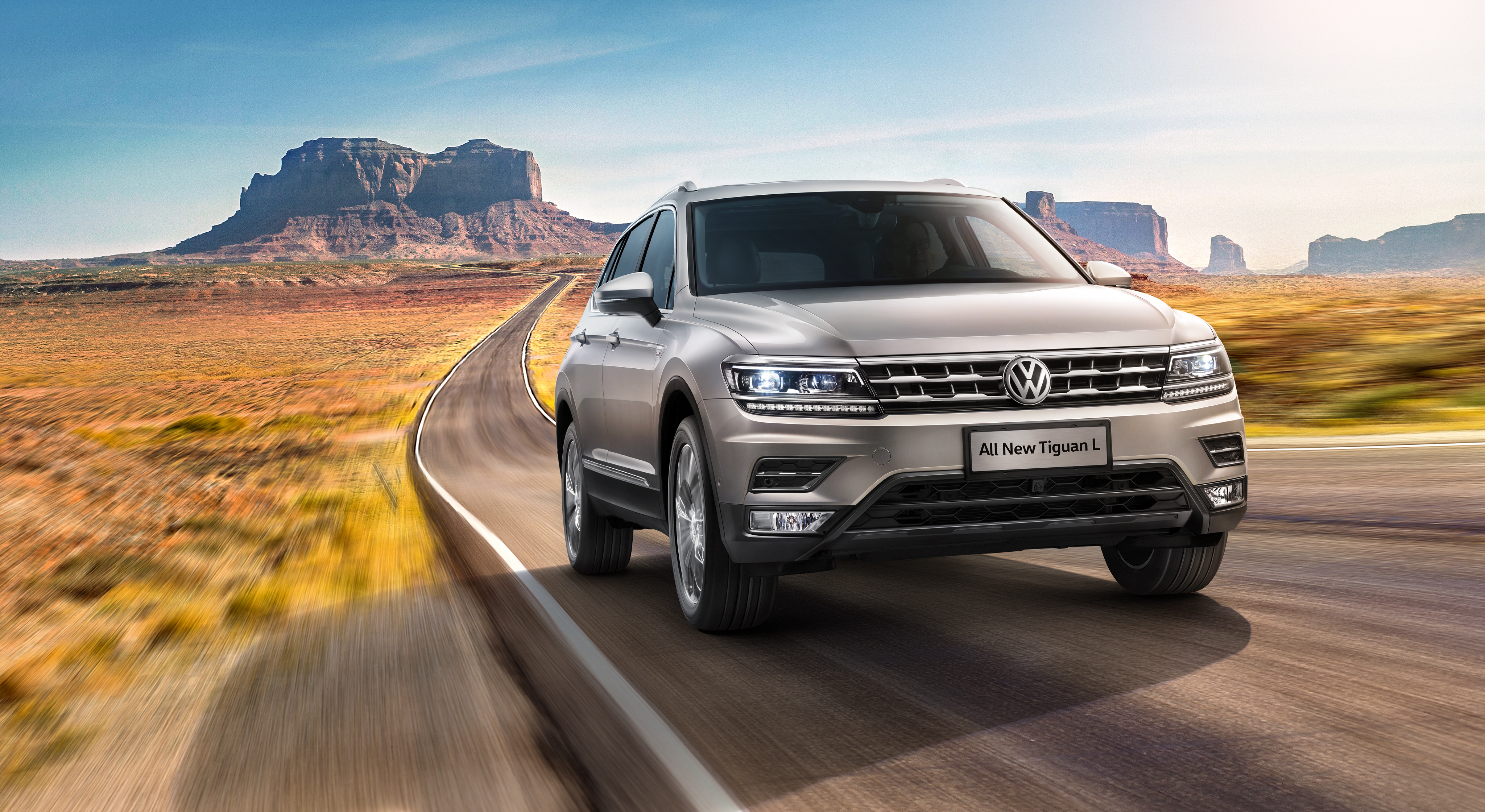 All New Volkswagen Tiguan L SUV on desert road HD Wallpaper