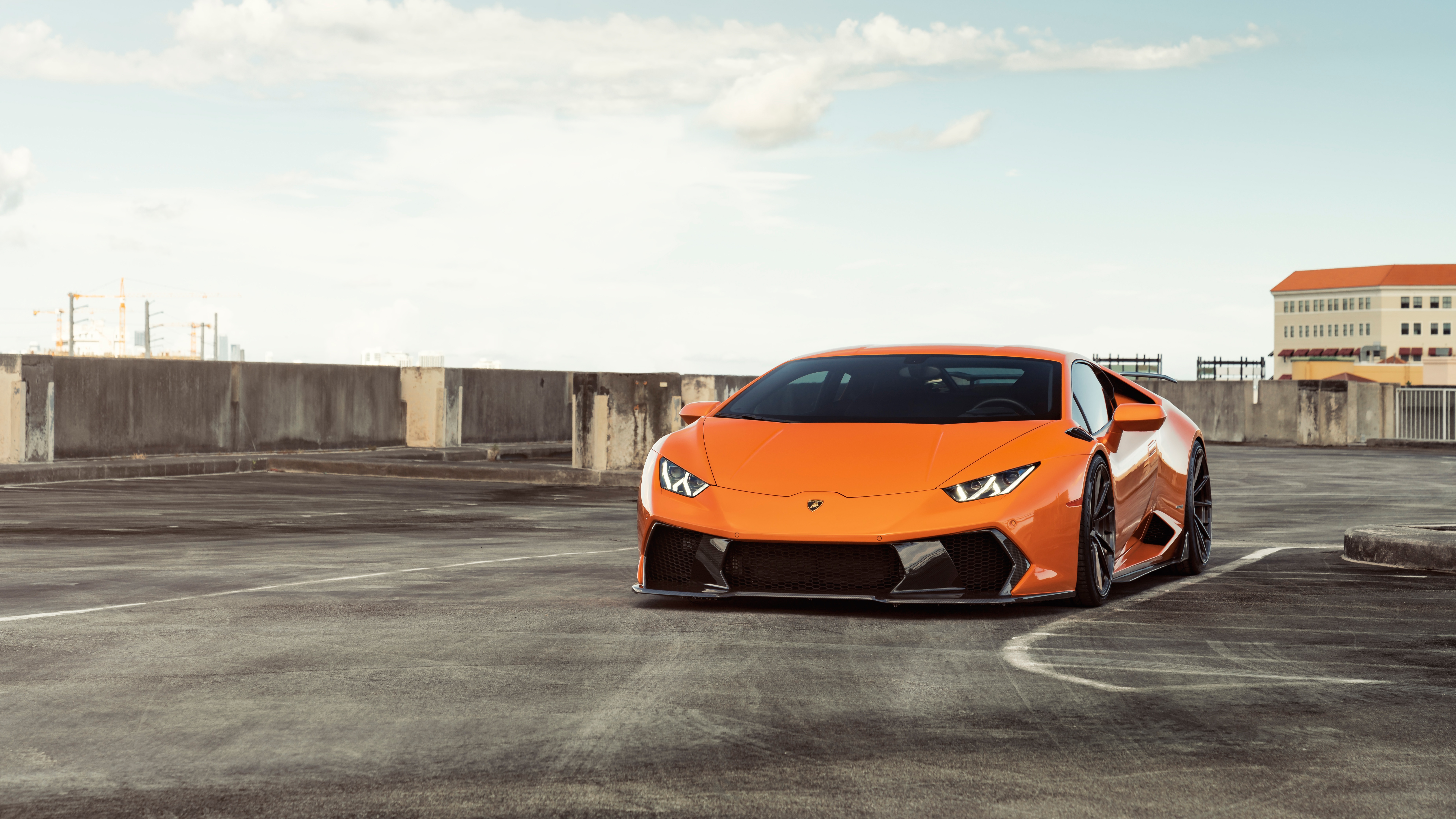 Orange Lamborghini Huracán Supercar on Rooftop HD Wallpaper