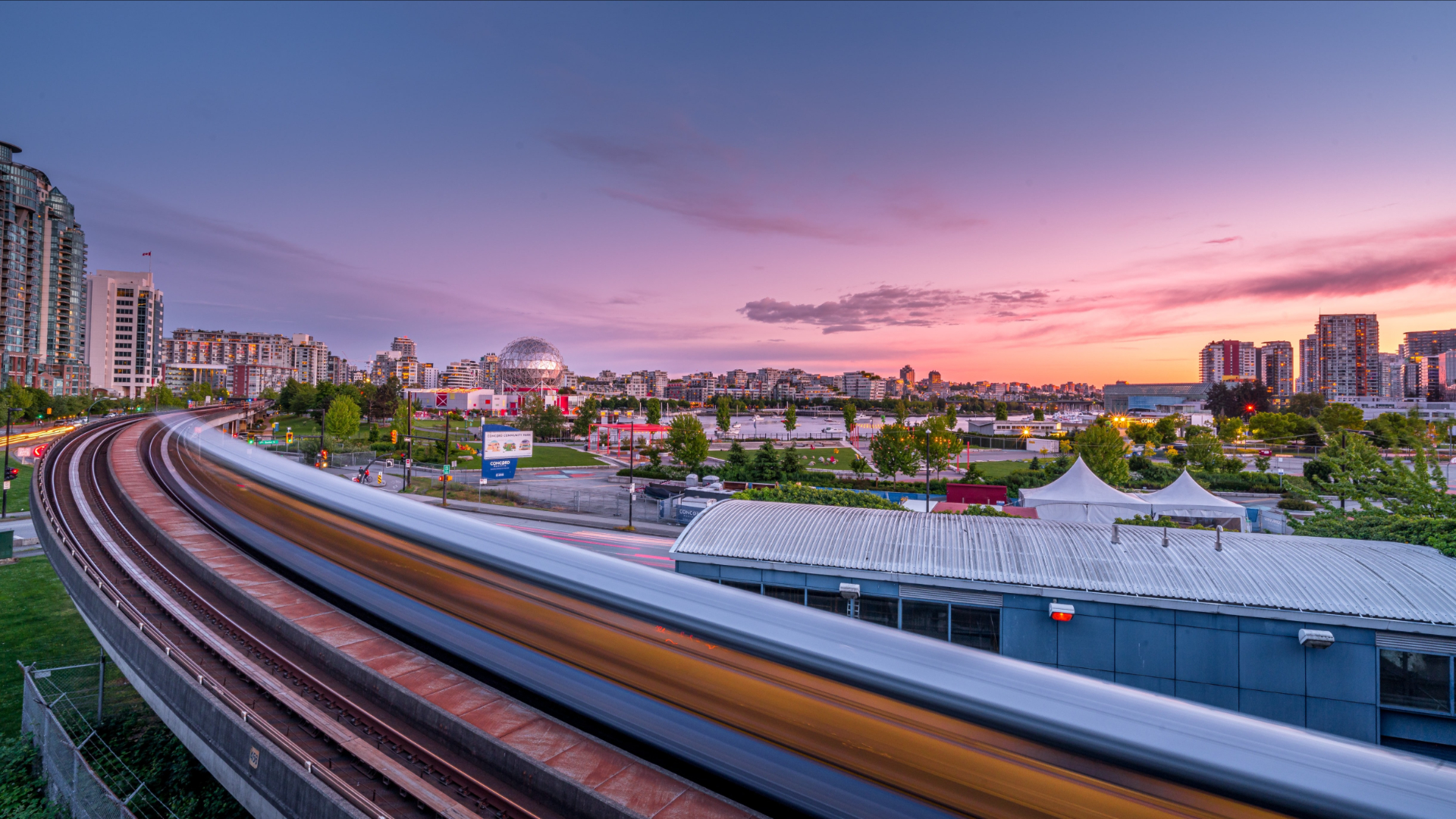 Vibrant Vancouver City Sunset with Skytrain Blur HD Wallpaper
