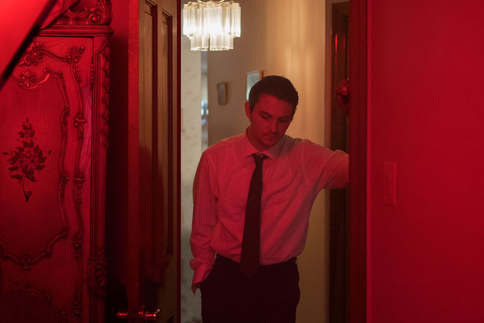 Shiloh Fernandez in red light from The Birthday Cake HD Wallpaper
