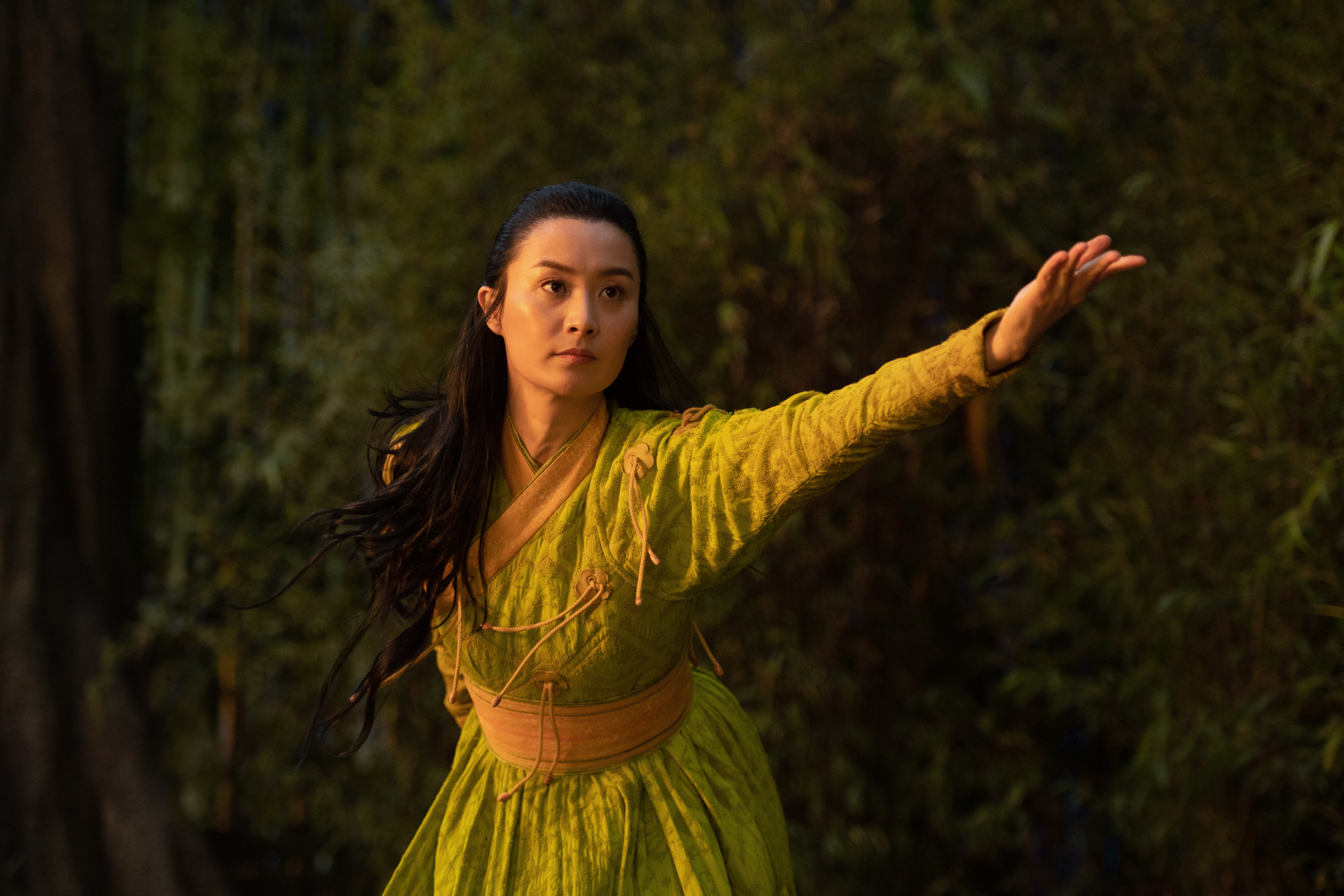 Fala Chen as Jiang Li in green with arm extended HD Wallpaper