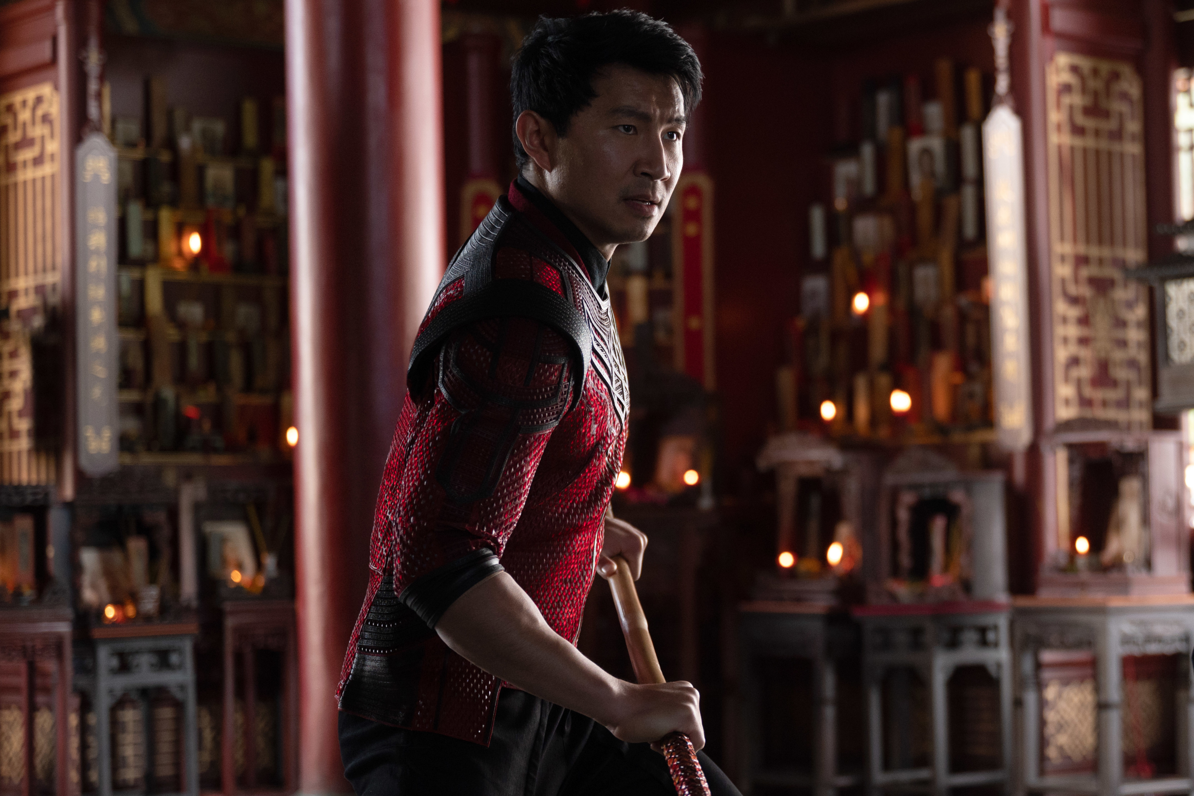 Shang-Chi holding a staff in a temple HD Wallpaper