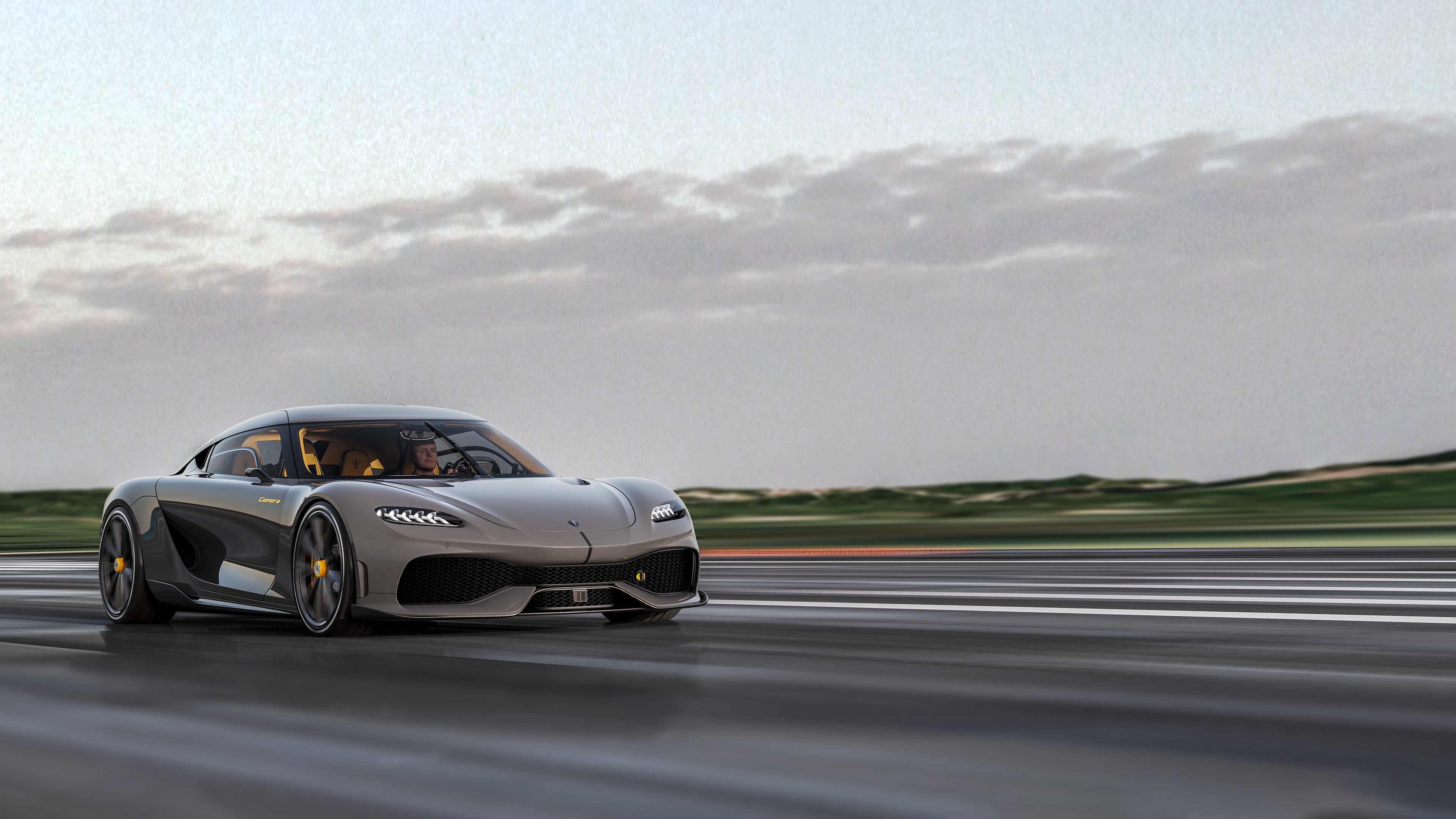 Koenigsegg Gemera driving on a highway HD Wallpaper