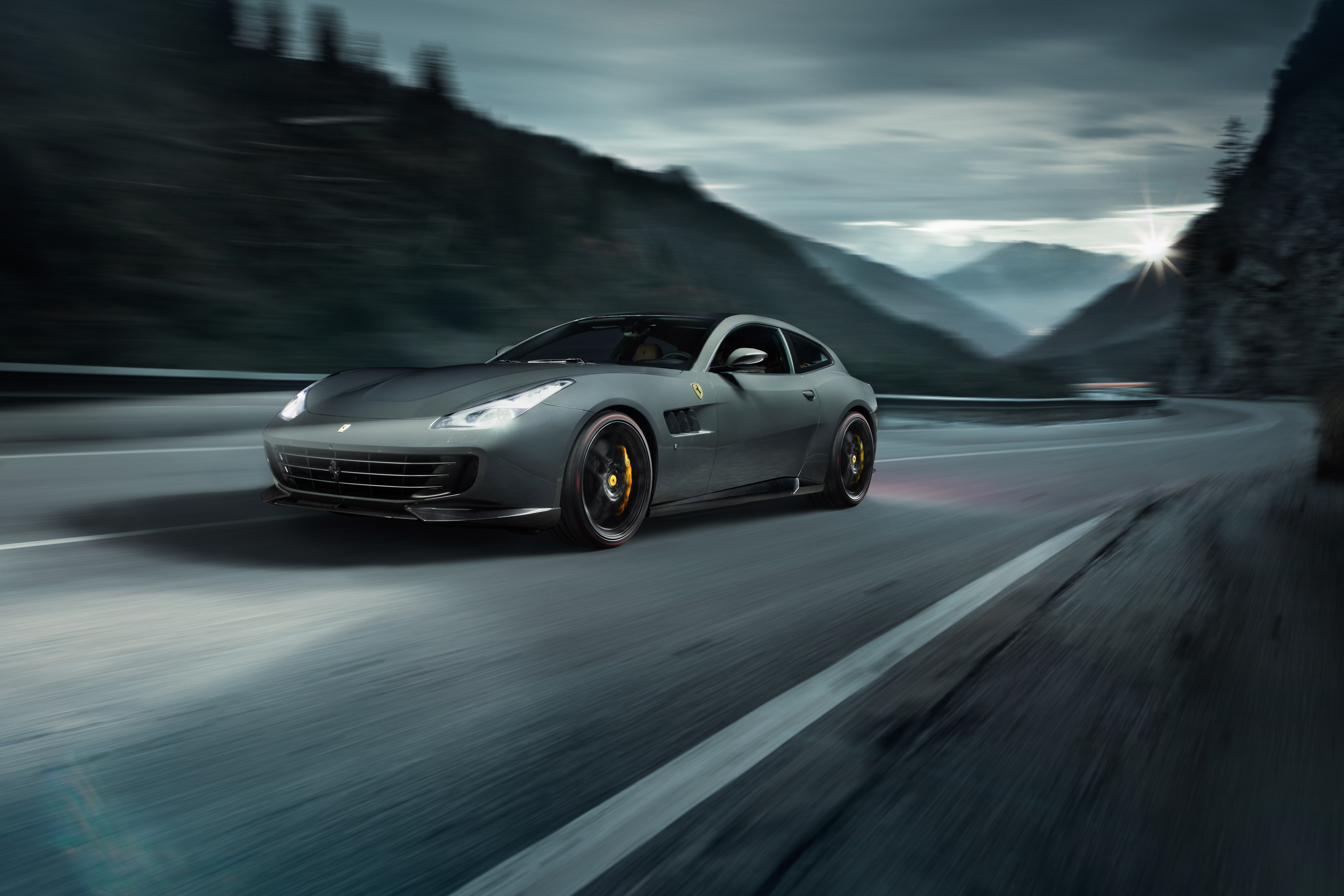 Novitec Rosso Ferrari GTC4Lusso speeding on a mountain road HD Wallpaper