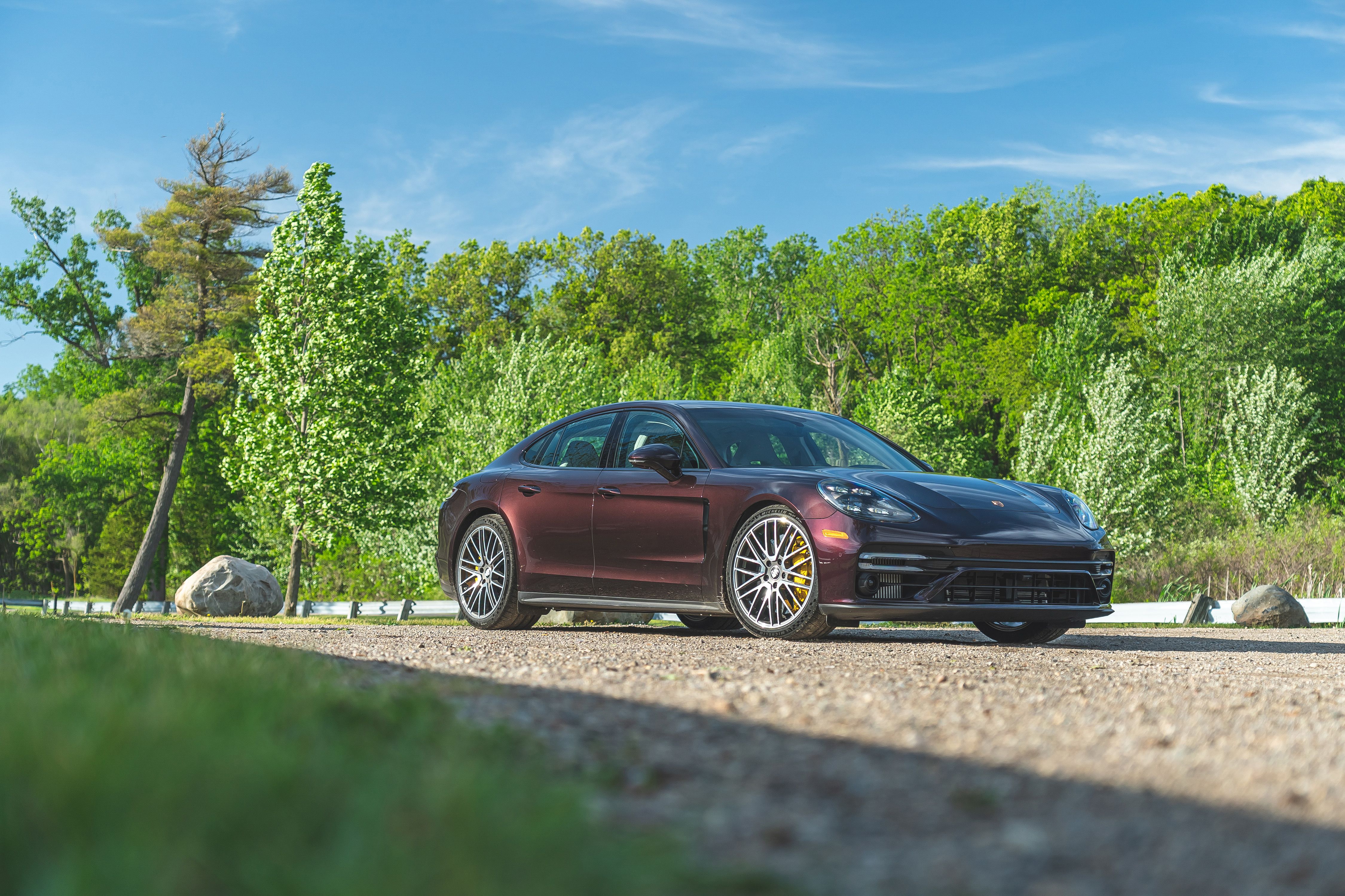 2021 Purple Porsche Panamera Turbo S on gravel path HD Wallpaper
