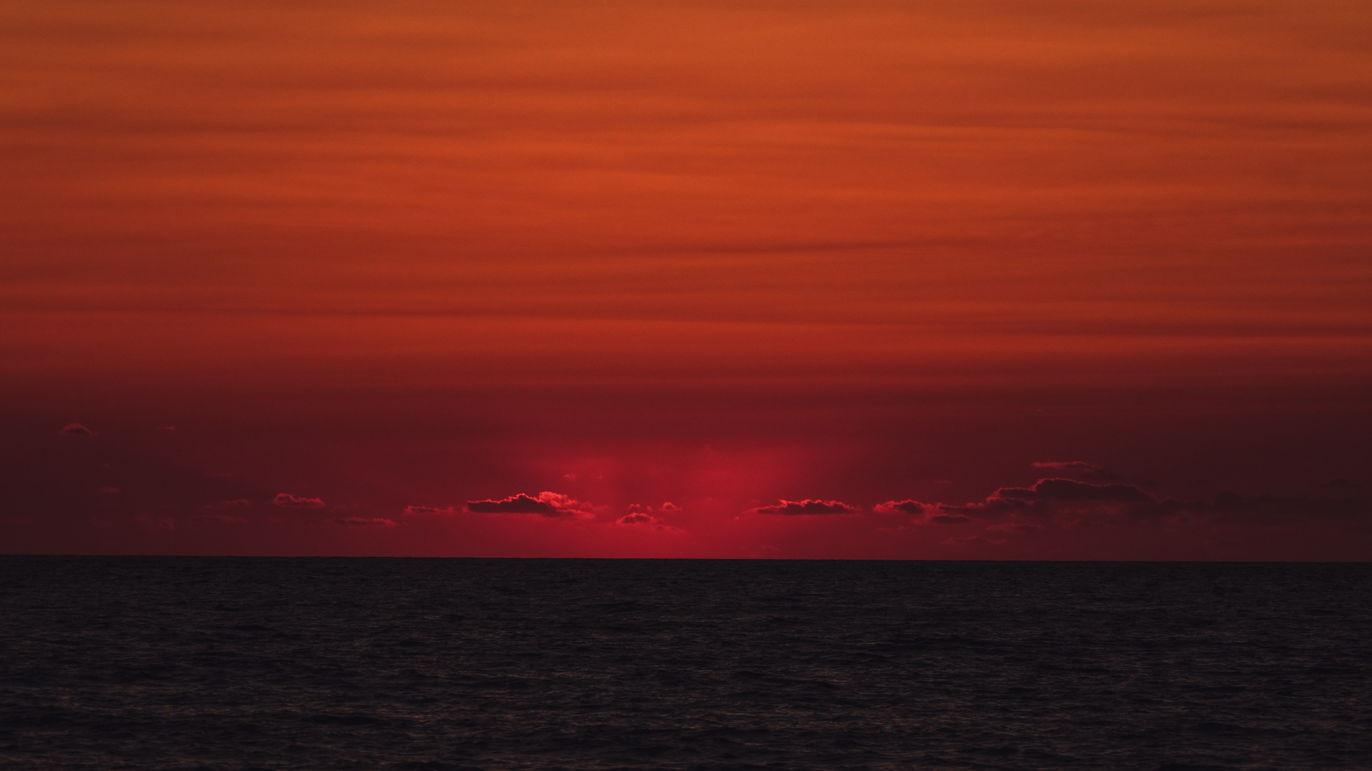 Fiery Red Sunset Sky Over Dark Ocean HD Wallpaper