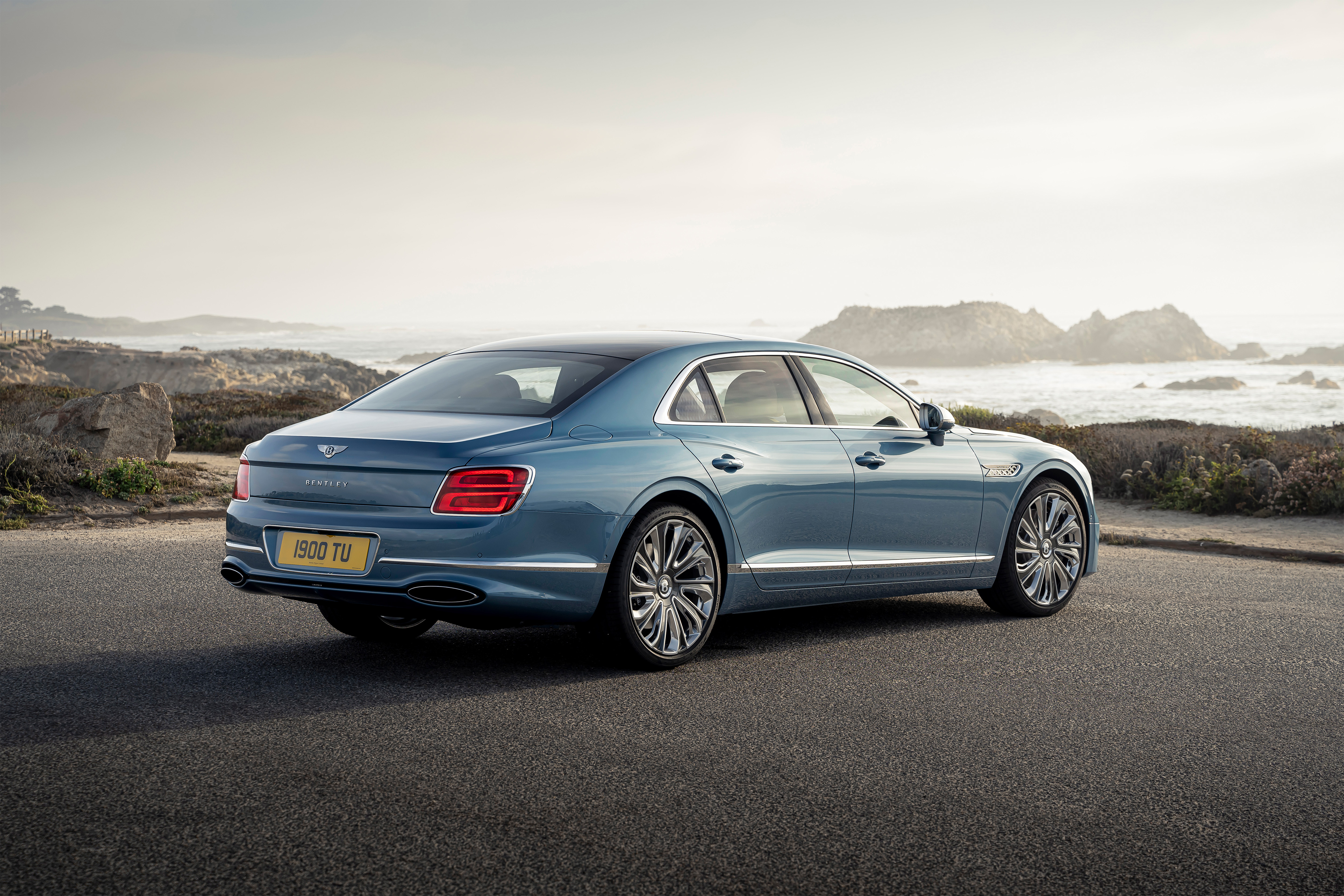 Bentley Flying Spur Mulliner parked on a coastal road HD Wallpaper