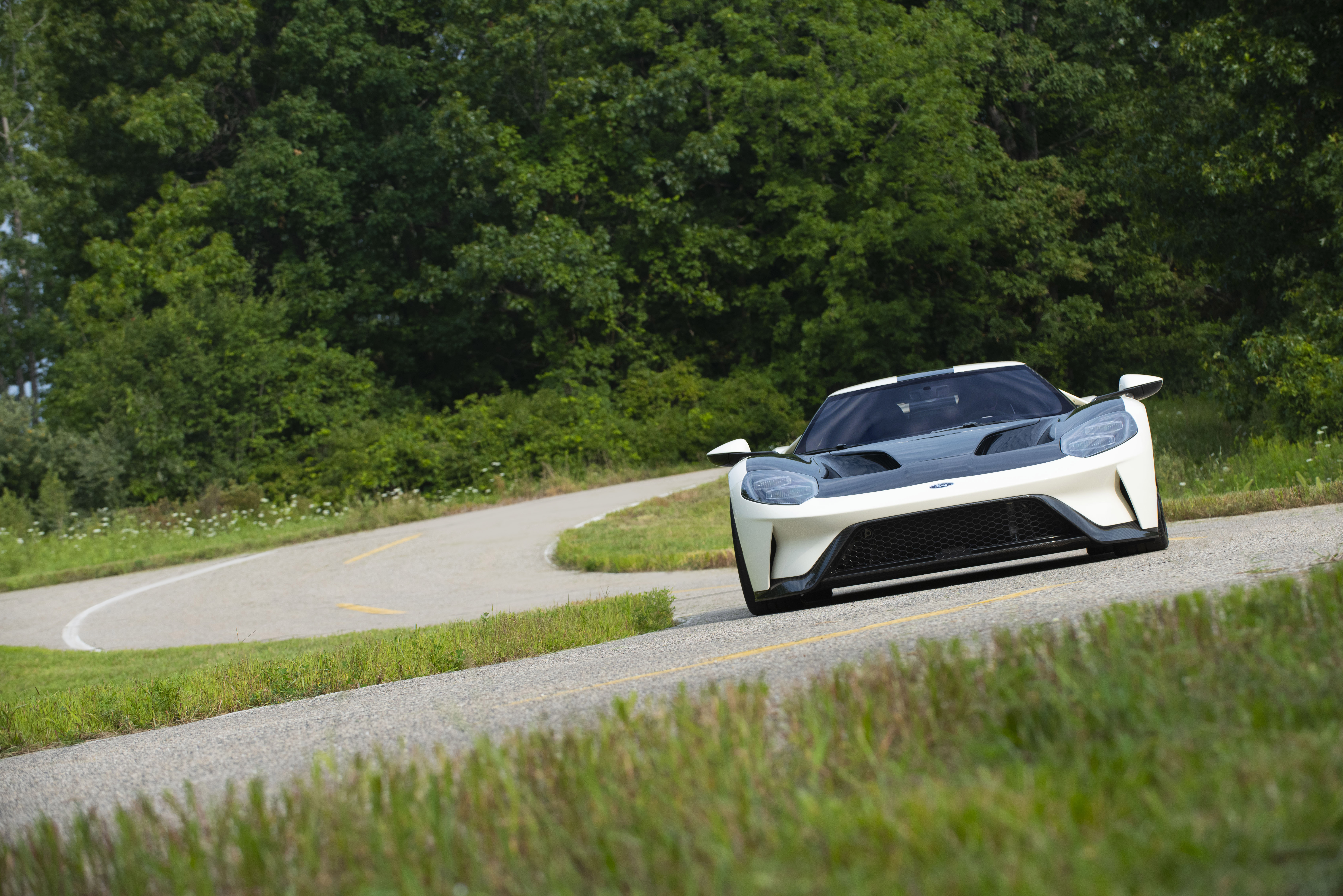 White Ford GT 64 Heritage Edition on winding road HD Wallpaper