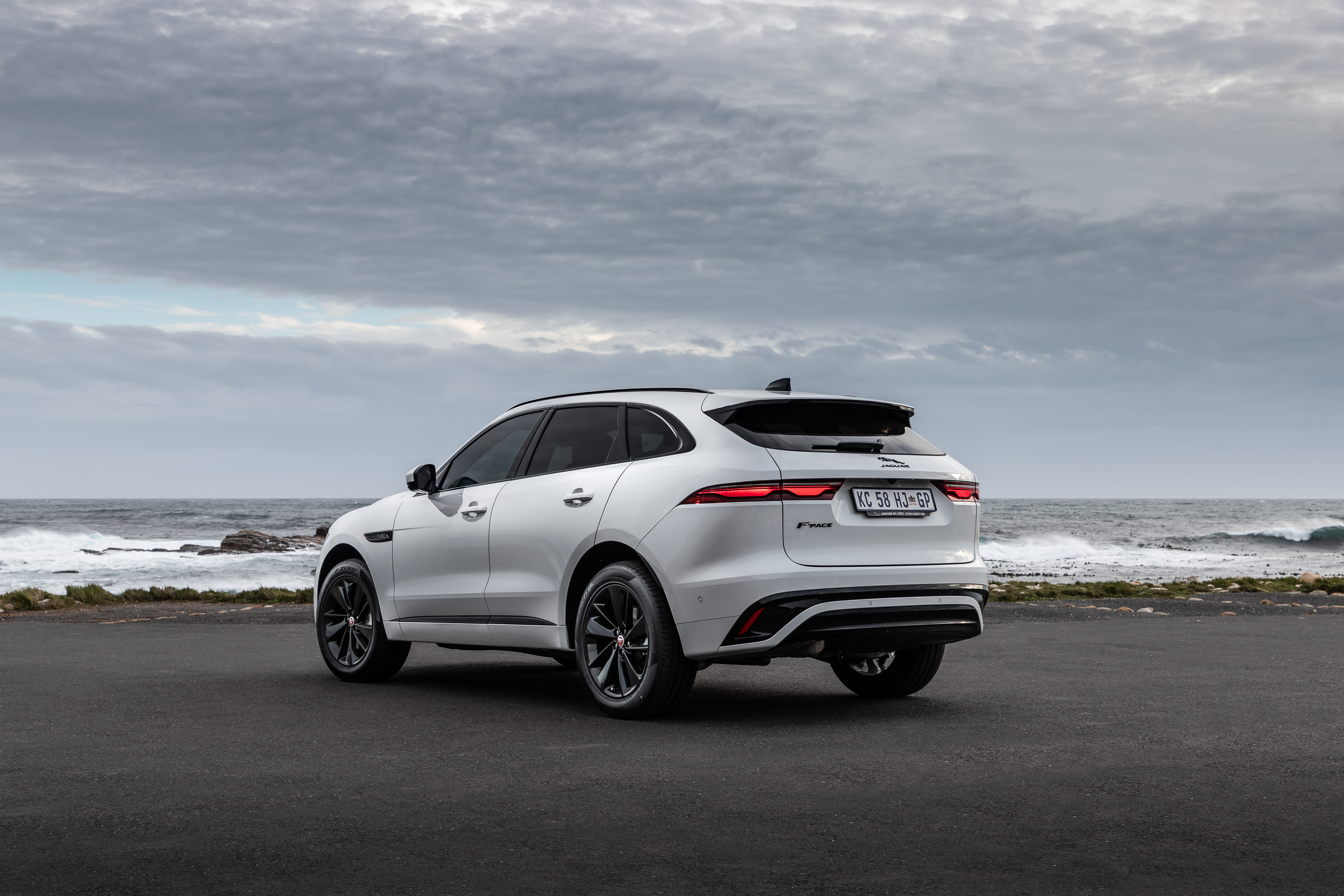 White Jaguar F-Pace luxury SUV by the ocean HD Wallpaper