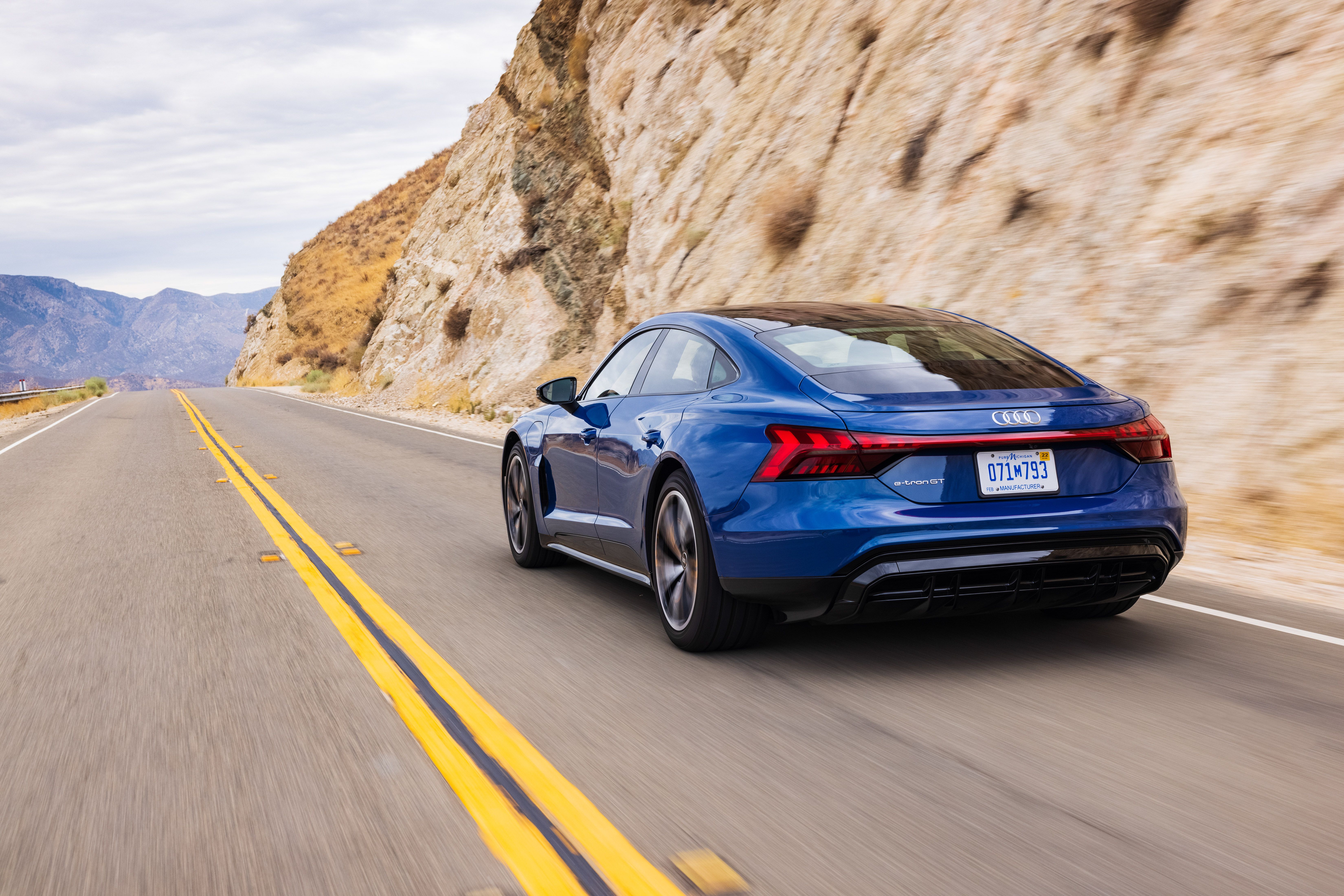 Blue Audi e-tron GT Quattro Driving on Mountain Road HD Wallpaper