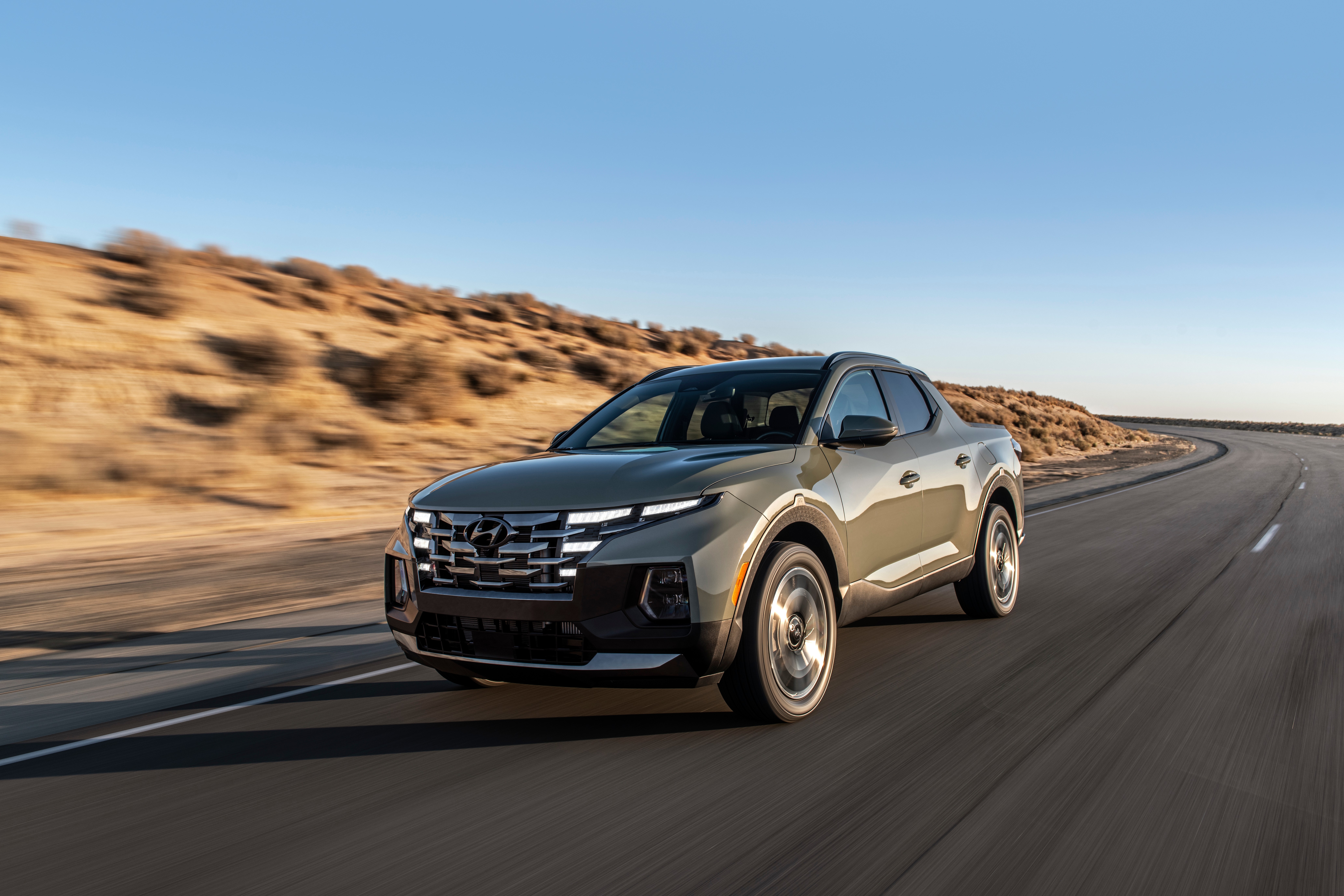 Hyundai Santa Cruz Pickup Driving on Desert Road HD Wallpaper
