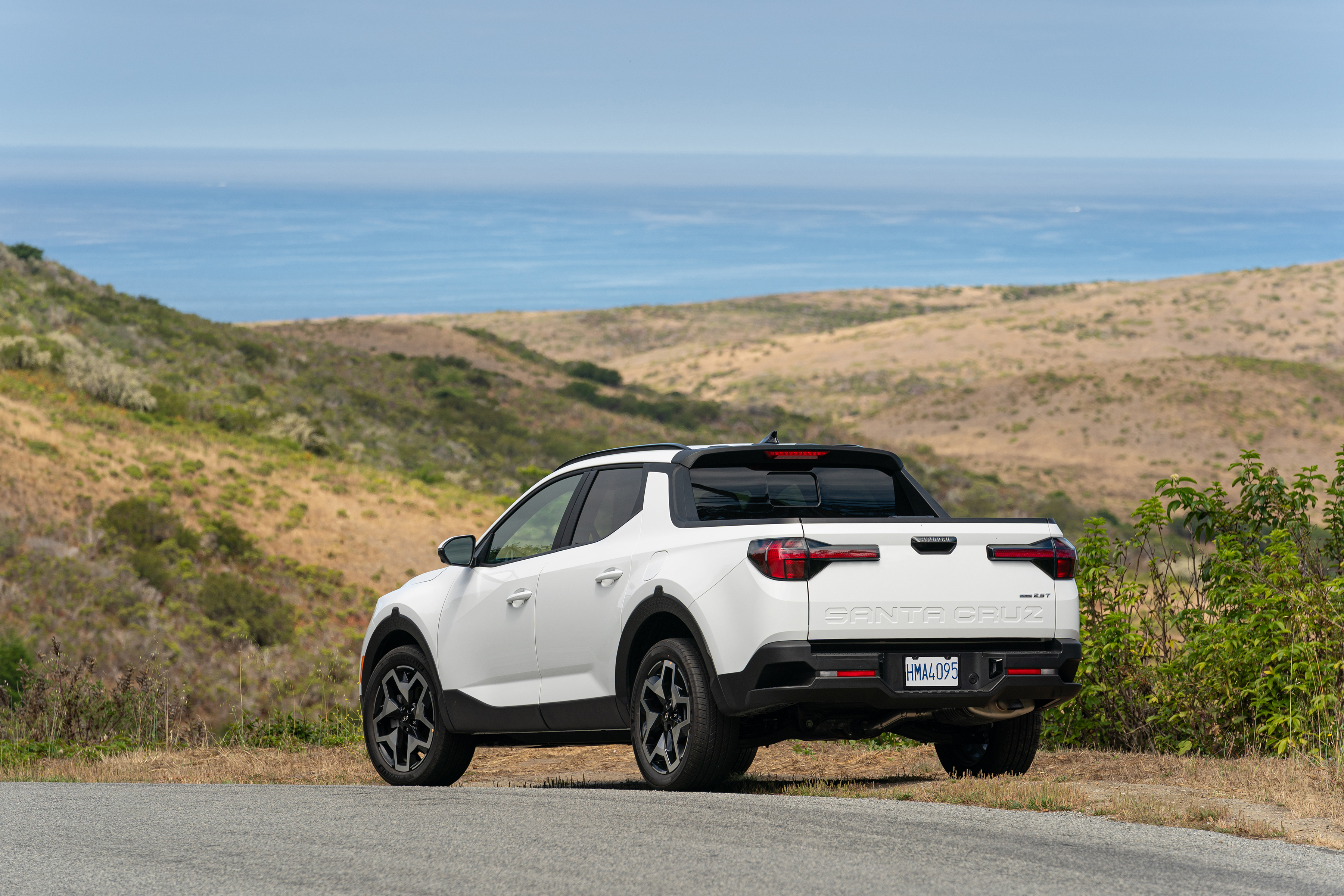 White Hyundai Santa Cruz pickup truck by the sea HD Wallpaper