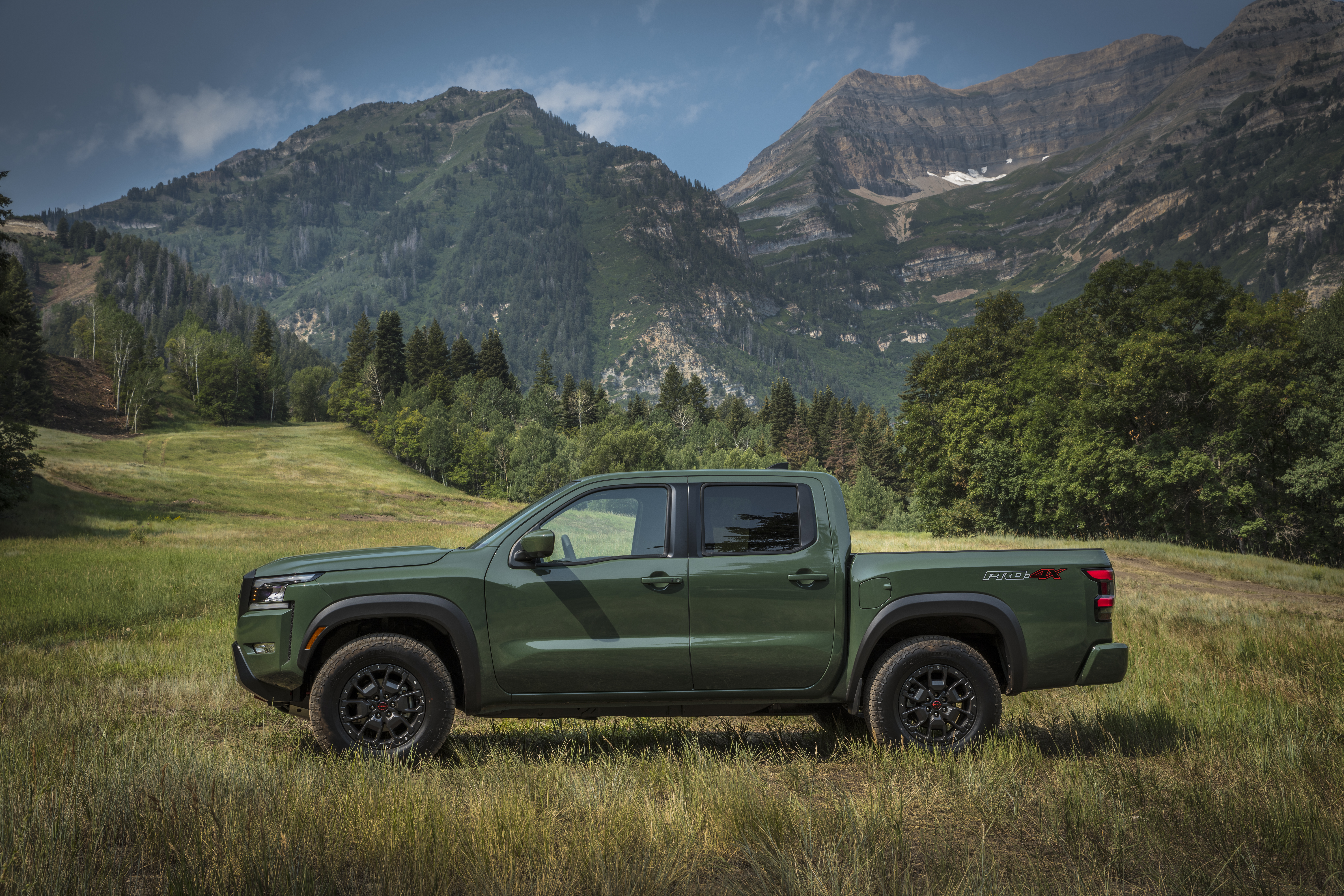 Green 2022 Nissan Frontier Pro-4X in mountain landscape HD Wallpaper