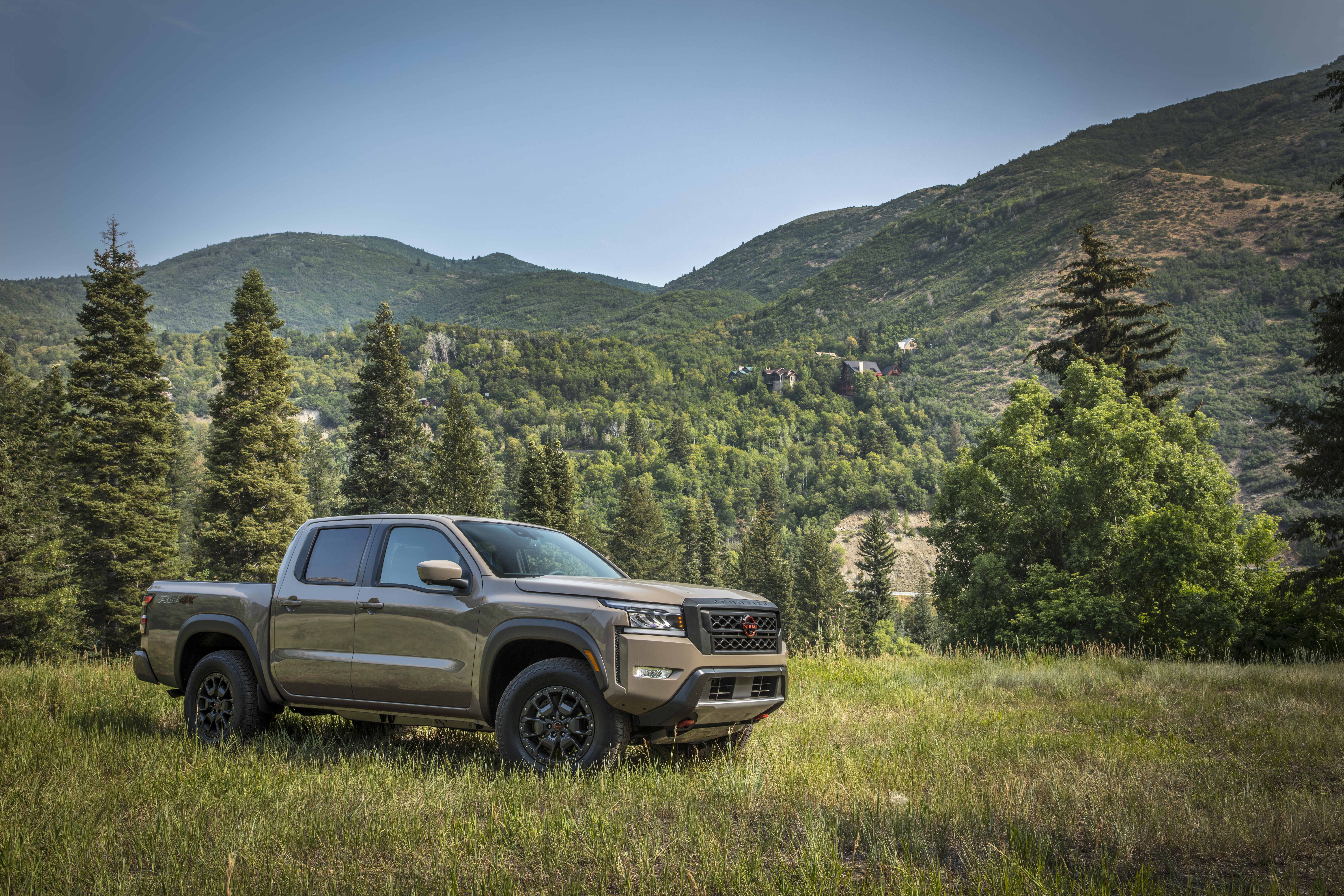Nissan Frontier Pro-4X pickup truck in mountain field HD Wallpaper