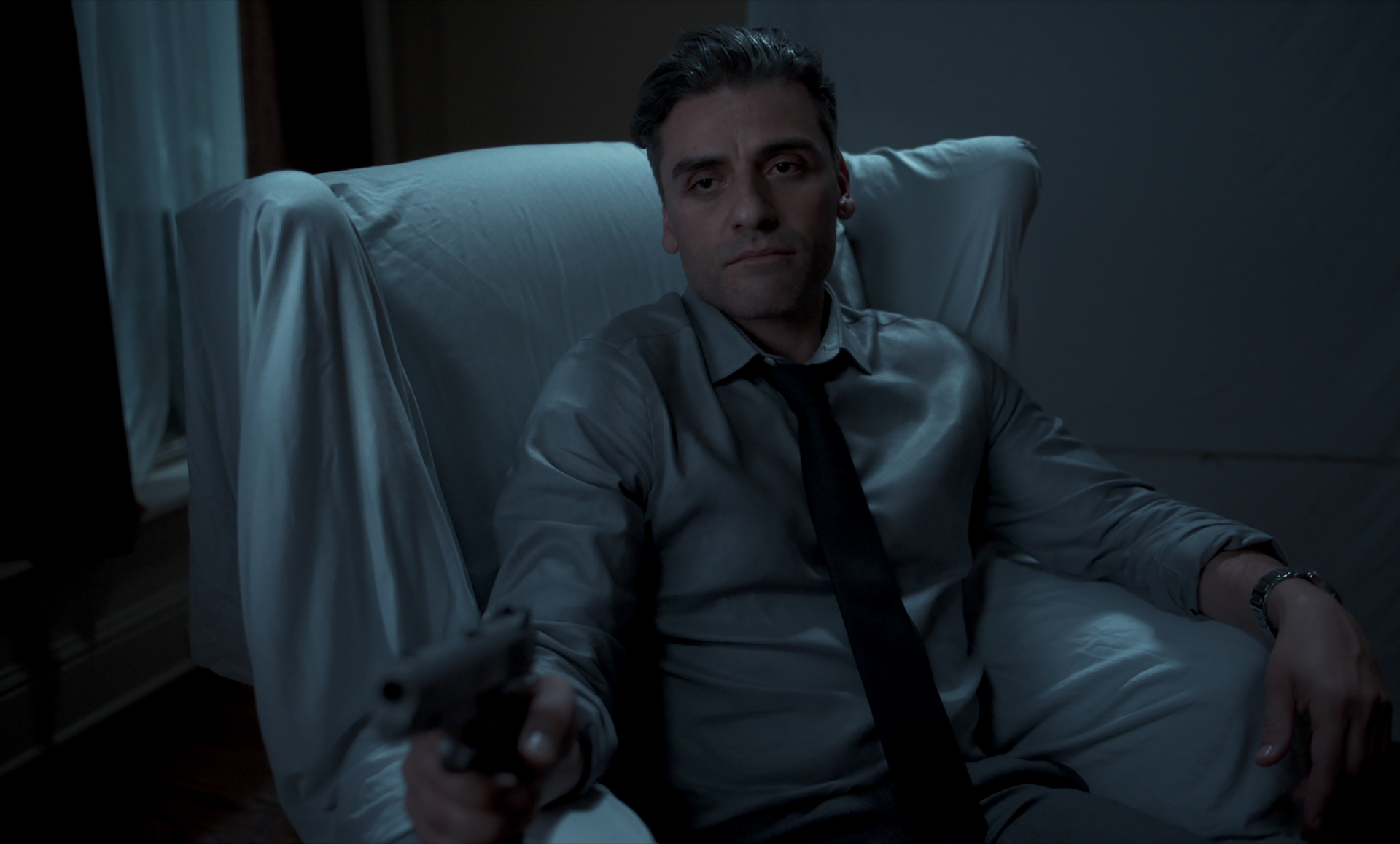 Oscar Isaac holding a gun in The Card Counter HD Wallpaper