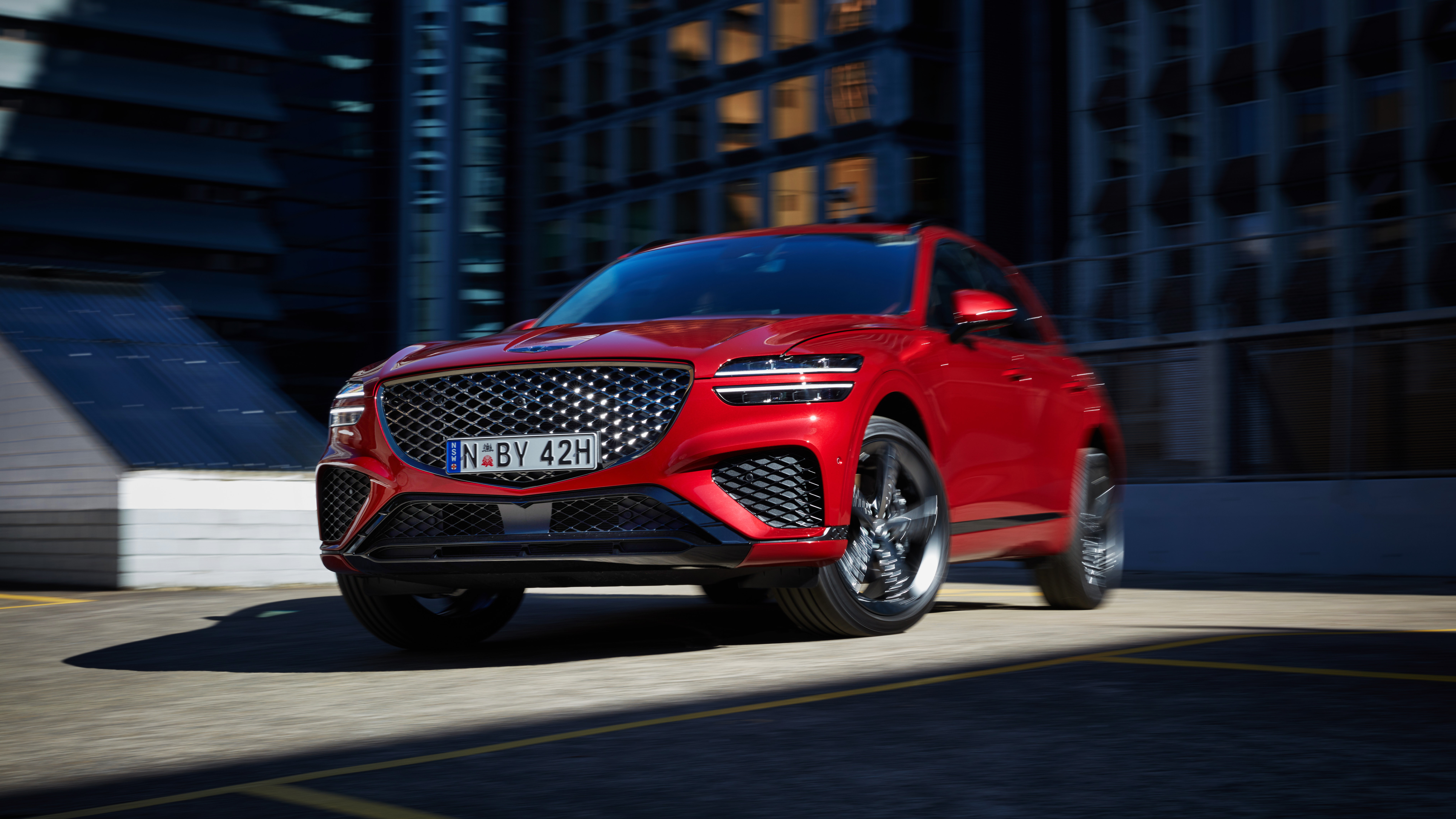 Red Genesis GV70 2.5T AWD SUV driving HD Wallpaper