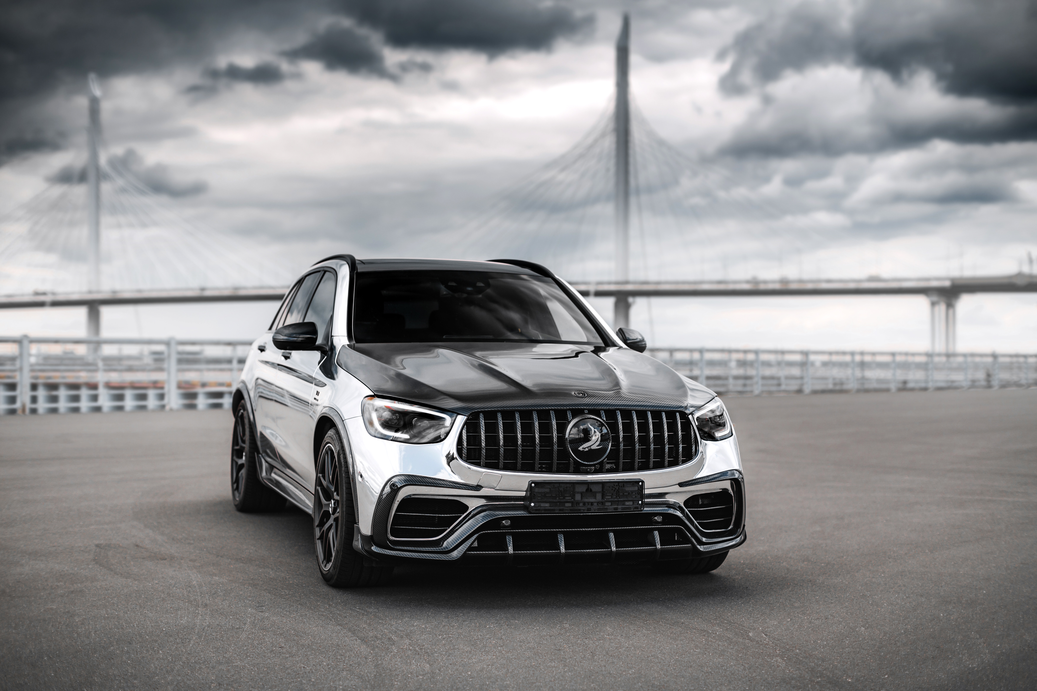 Mercedes-AMG GLC-Klasse Inferno SUV with chrome finish and bridge HD Wallpaper