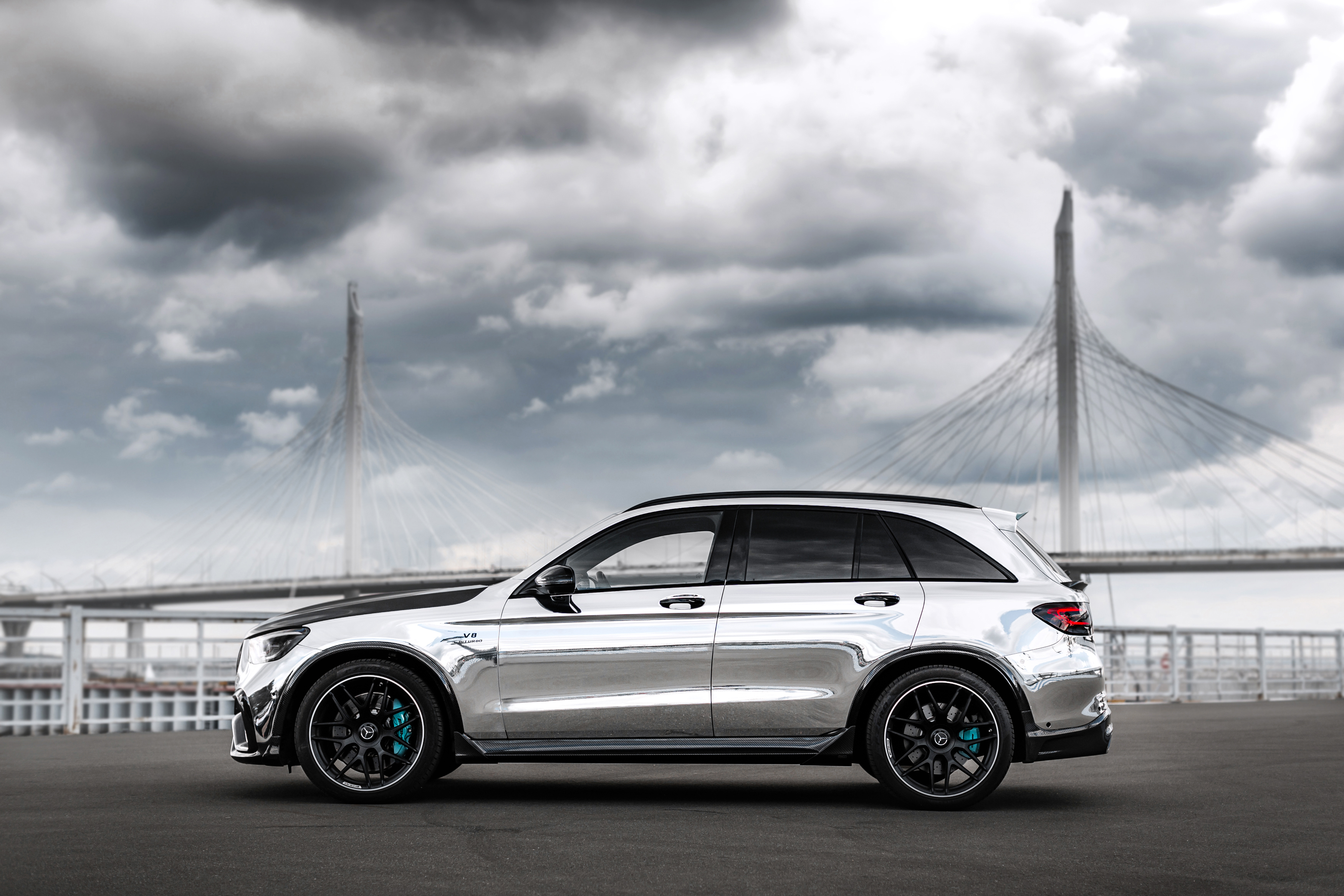 Chrome Mercedes-AMG GLC-Klasse SUV under dramatic sky HD Wallpaper