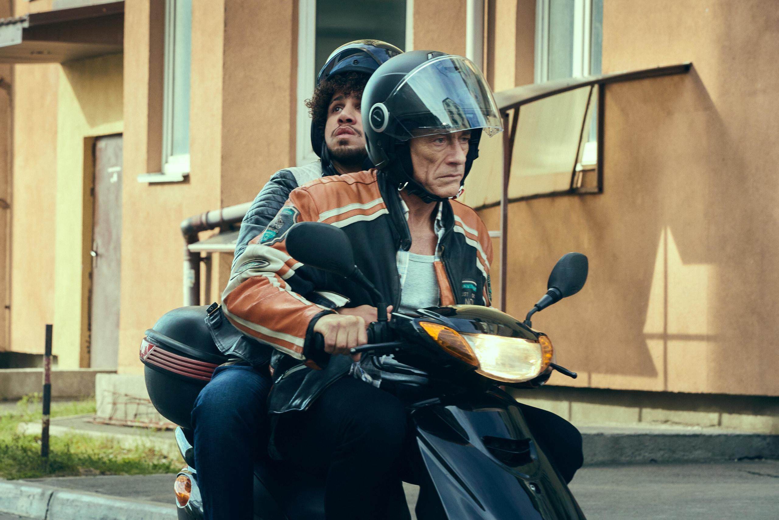 Jean-Claude Van Damme driving scooter in The Last Mercenary HD Wallpaper