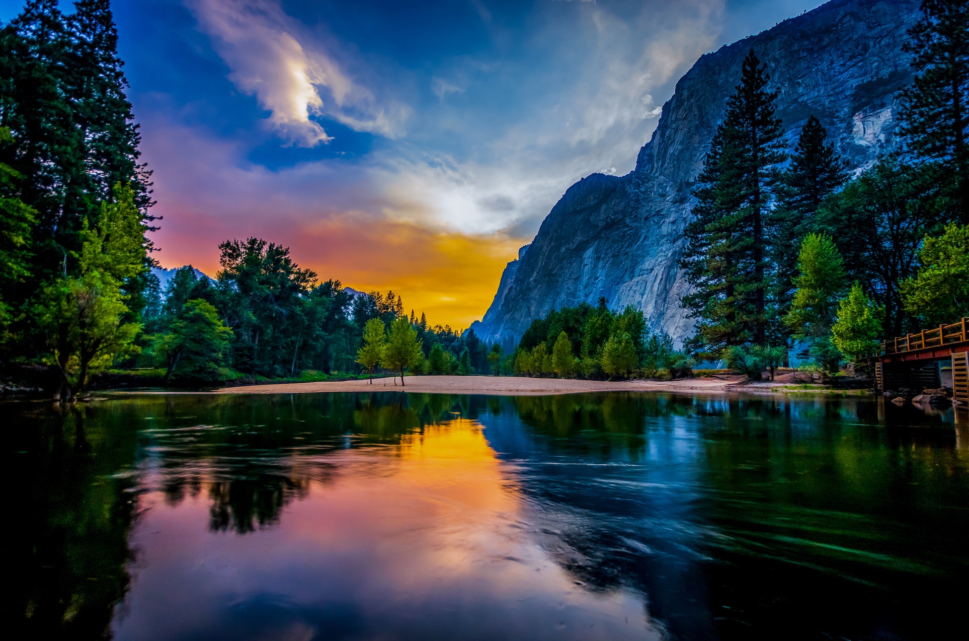 Vibrant sky reflected in a tranquil lake HD Wallpaper