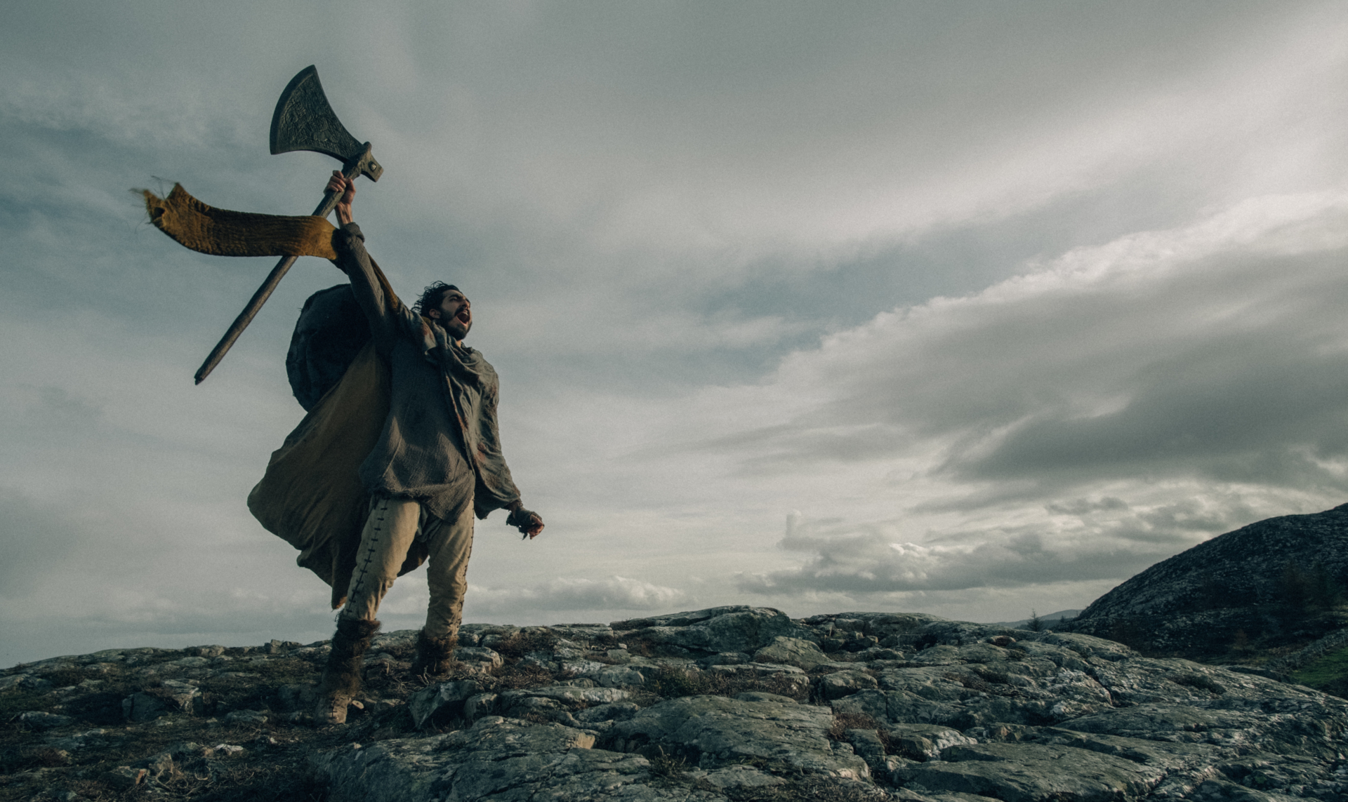 Dev Patel in The Green Knight holding an axe HD Wallpaper