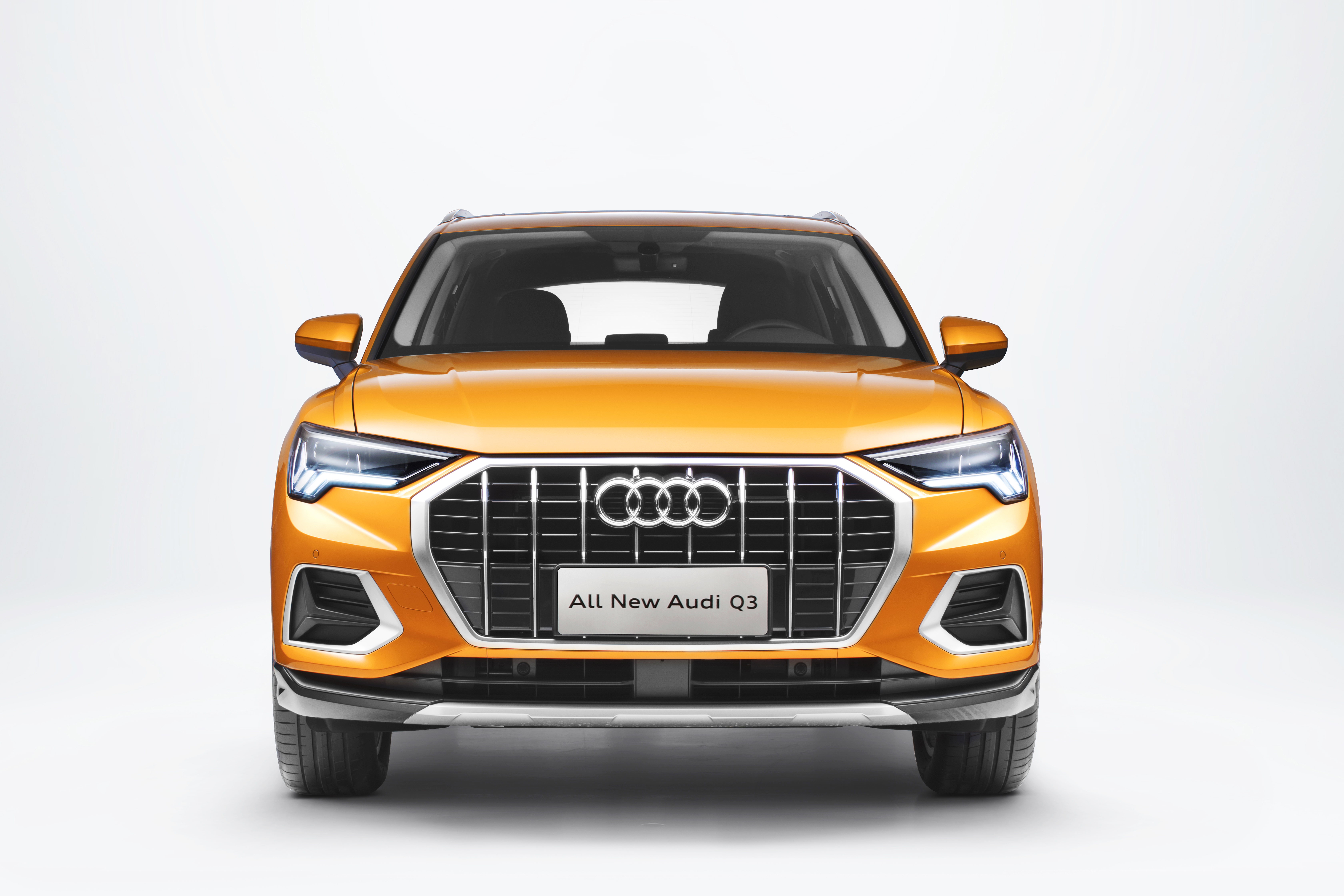 All New Audi Q3 orange SUV front view HD Wallpaper