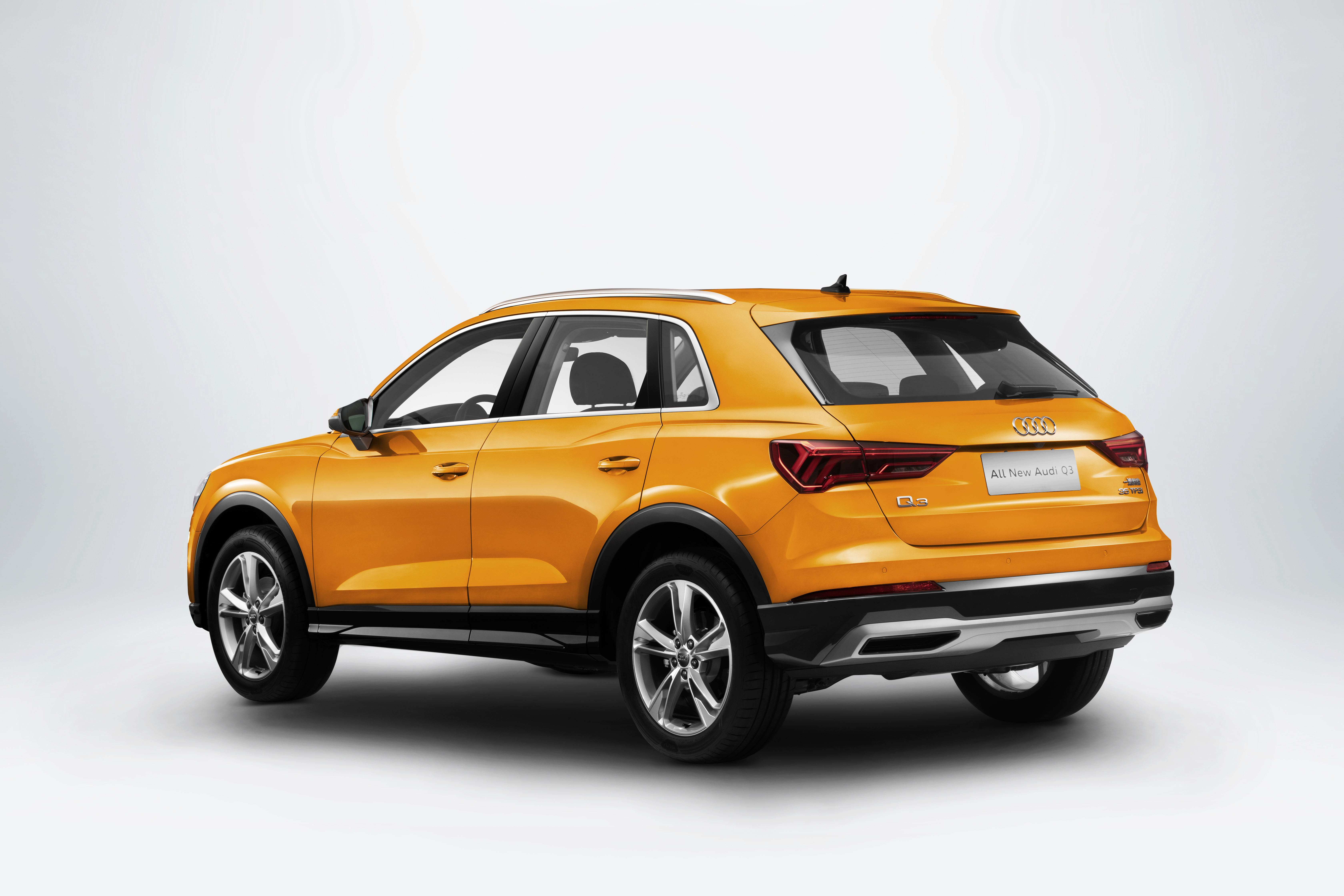 Orange Audi Q3 35 TFSI SUV rear view HD Wallpaper