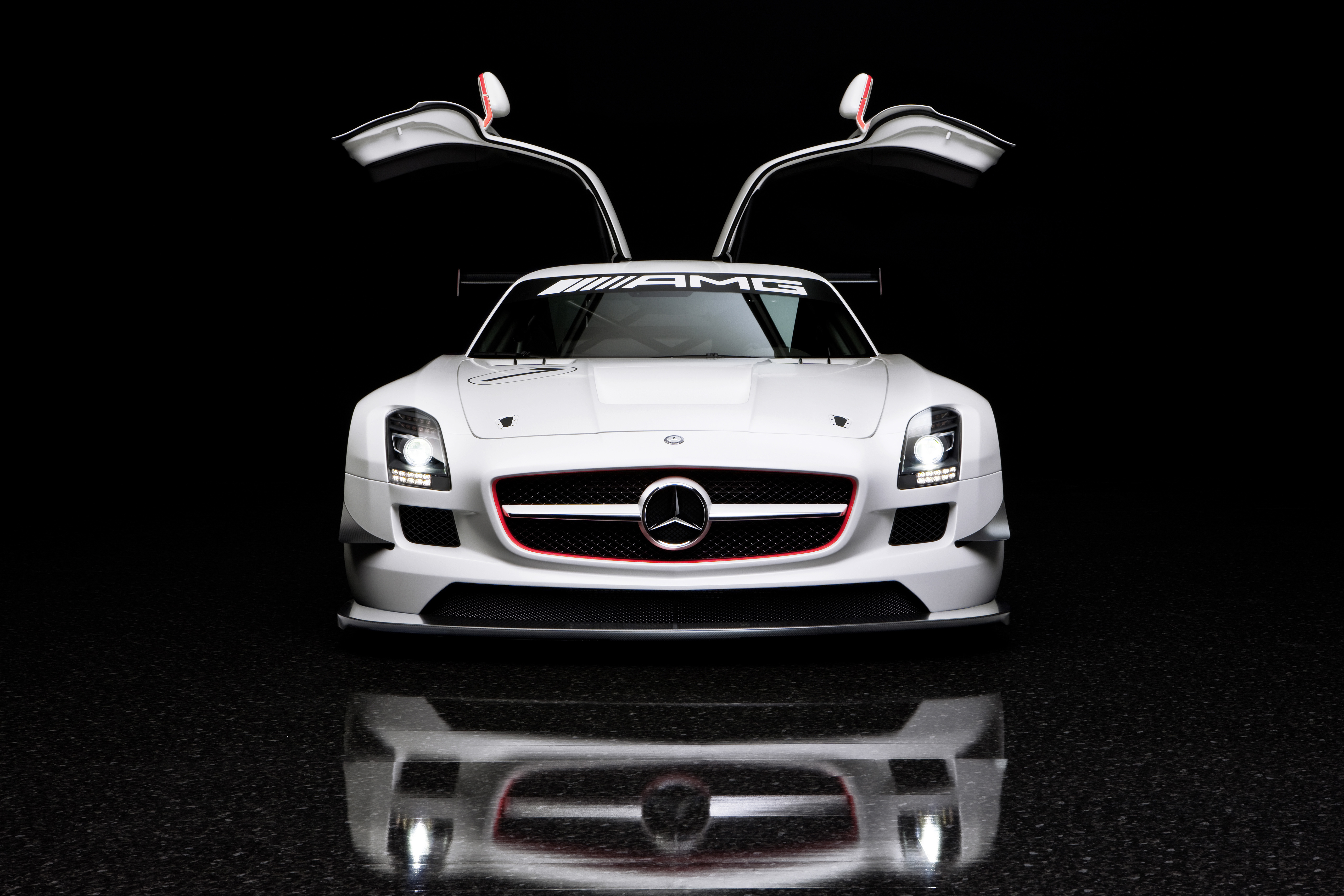 White Mercedes-Benz SLS AMG GT3 with open gullwing doors HD Wallpaper