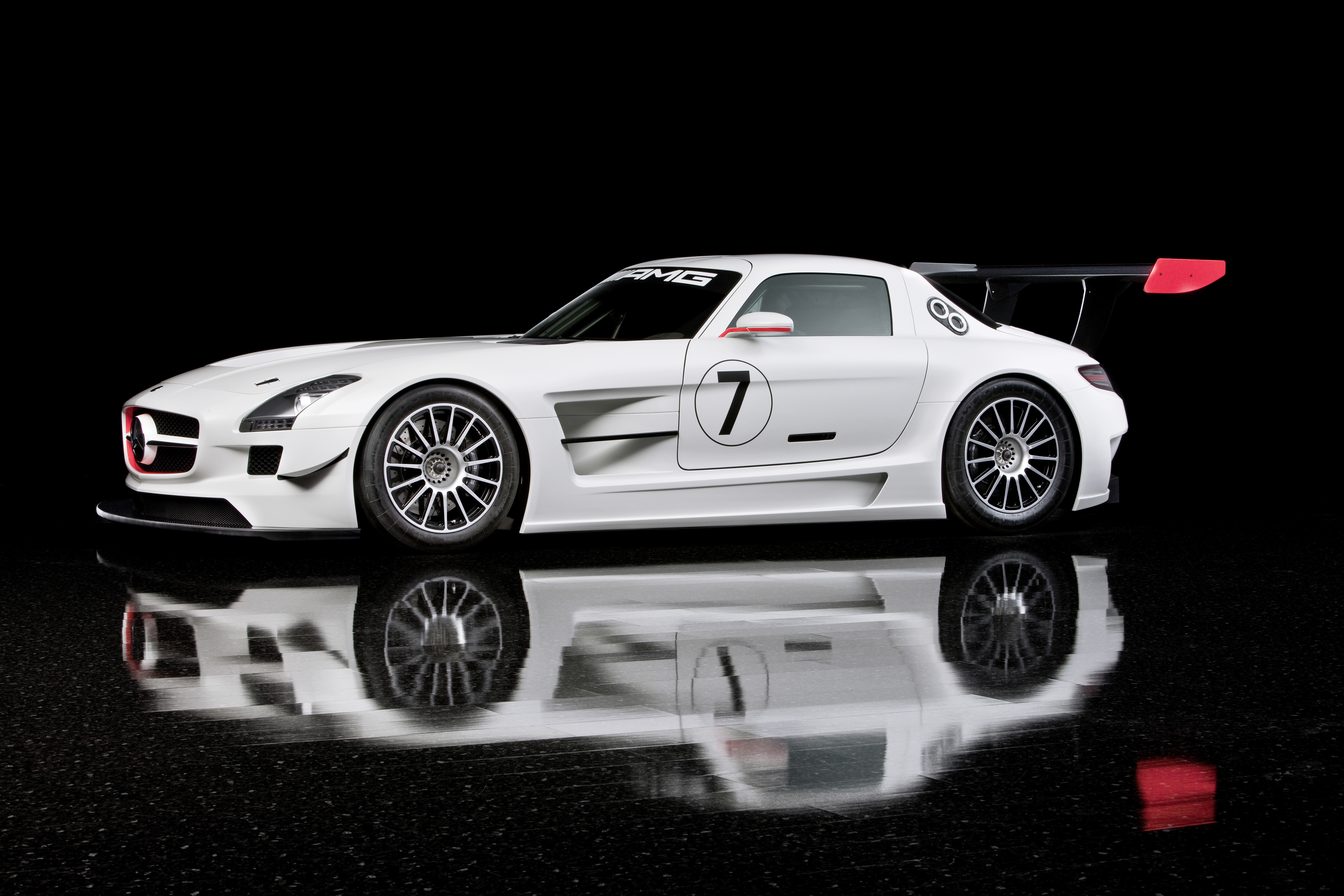 White Mercedes-Benz SLS 63 AMG GT3 Race Car on Black HD Wallpaper