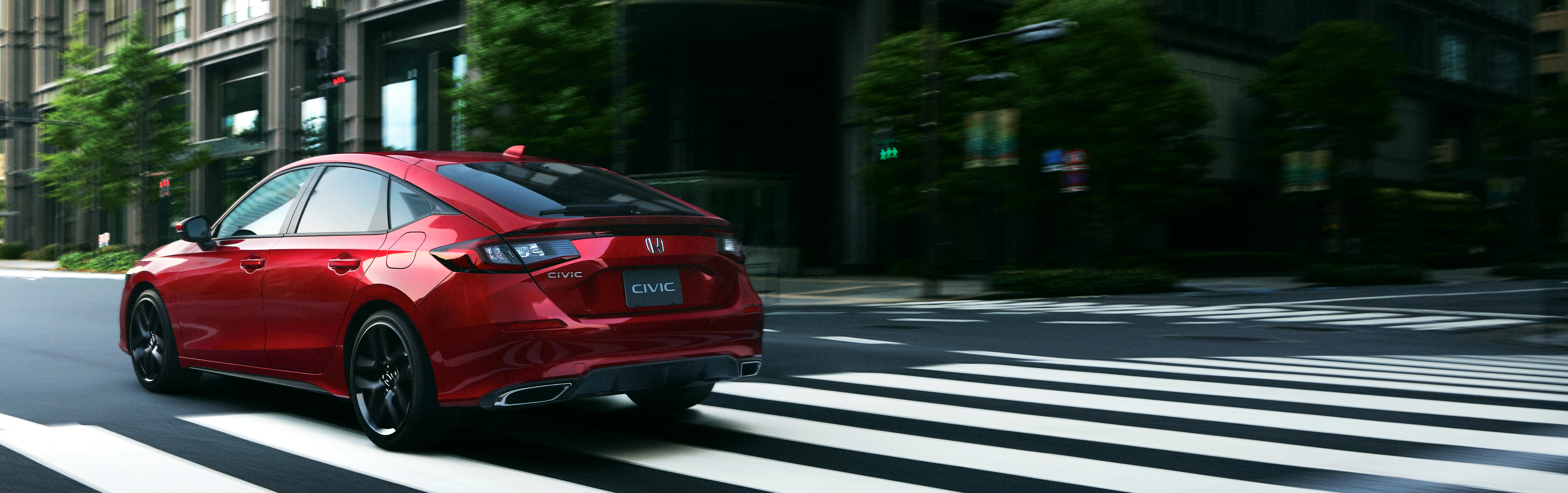 Red Honda Civic Hatchback Driving on City Street HD Wallpaper