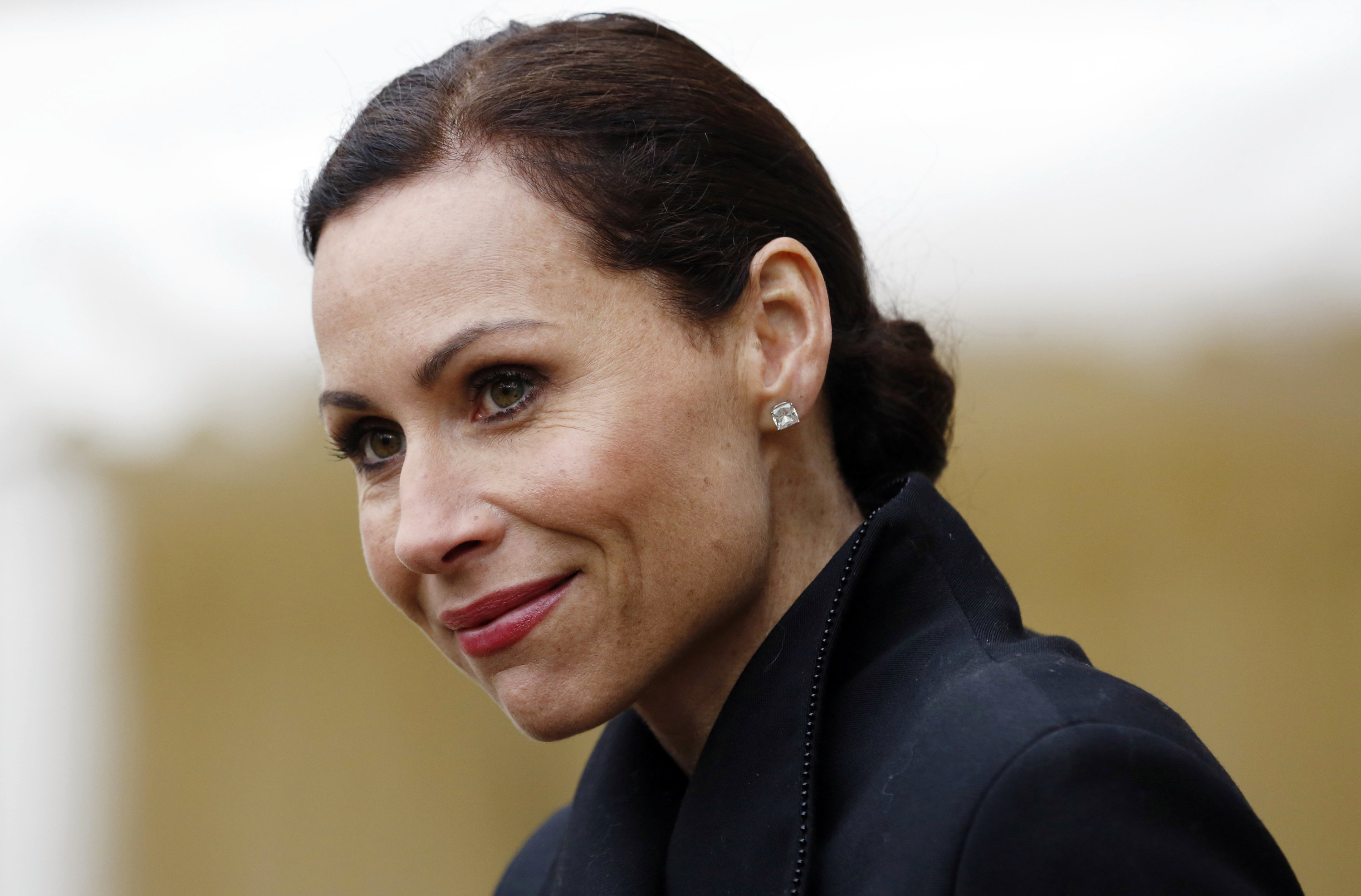 Minnie Driver smiling in a close-up shot HD Wallpaper
