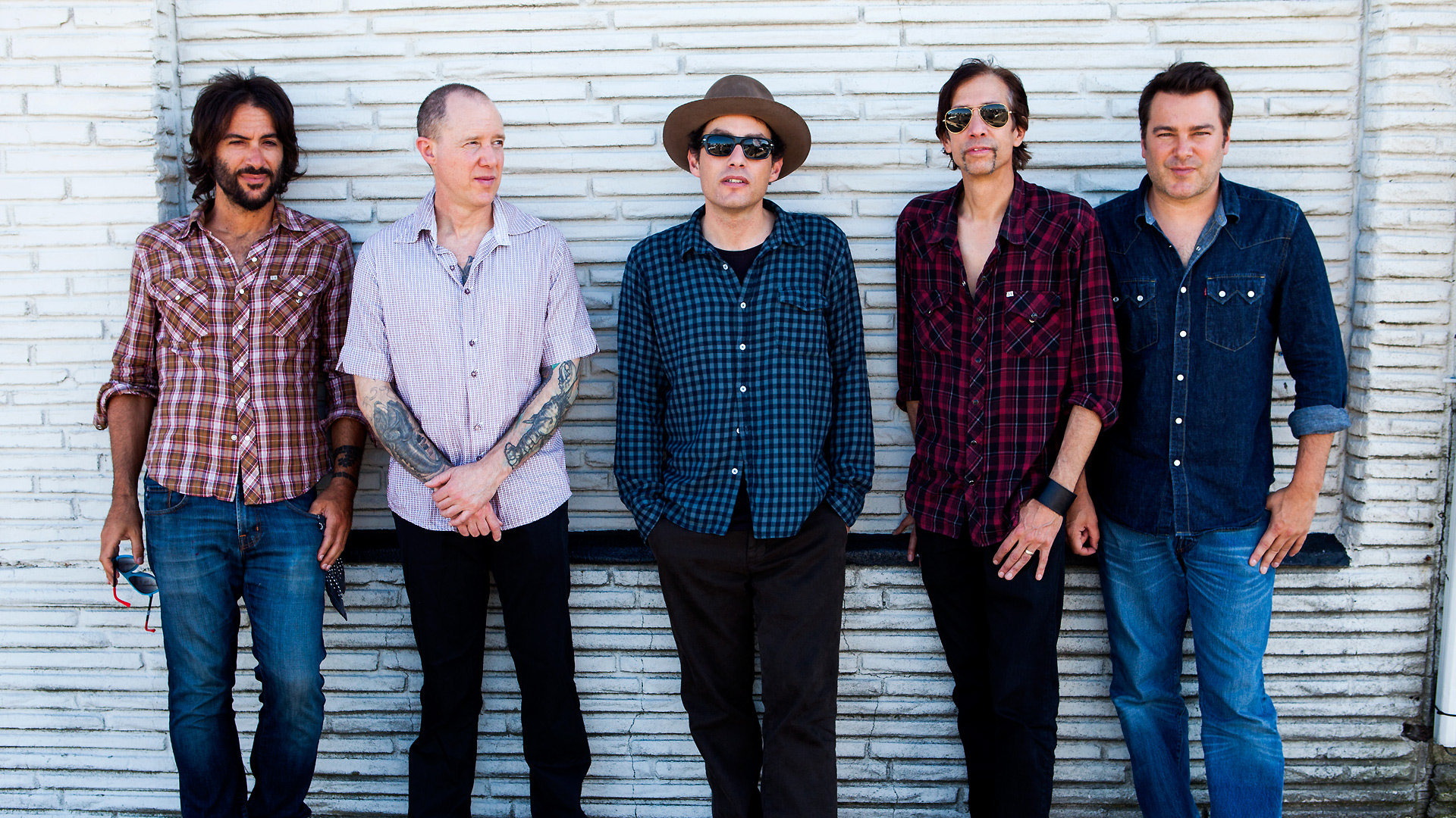 The Wallflowers band posing in front of a brick wall HD Wallpaper