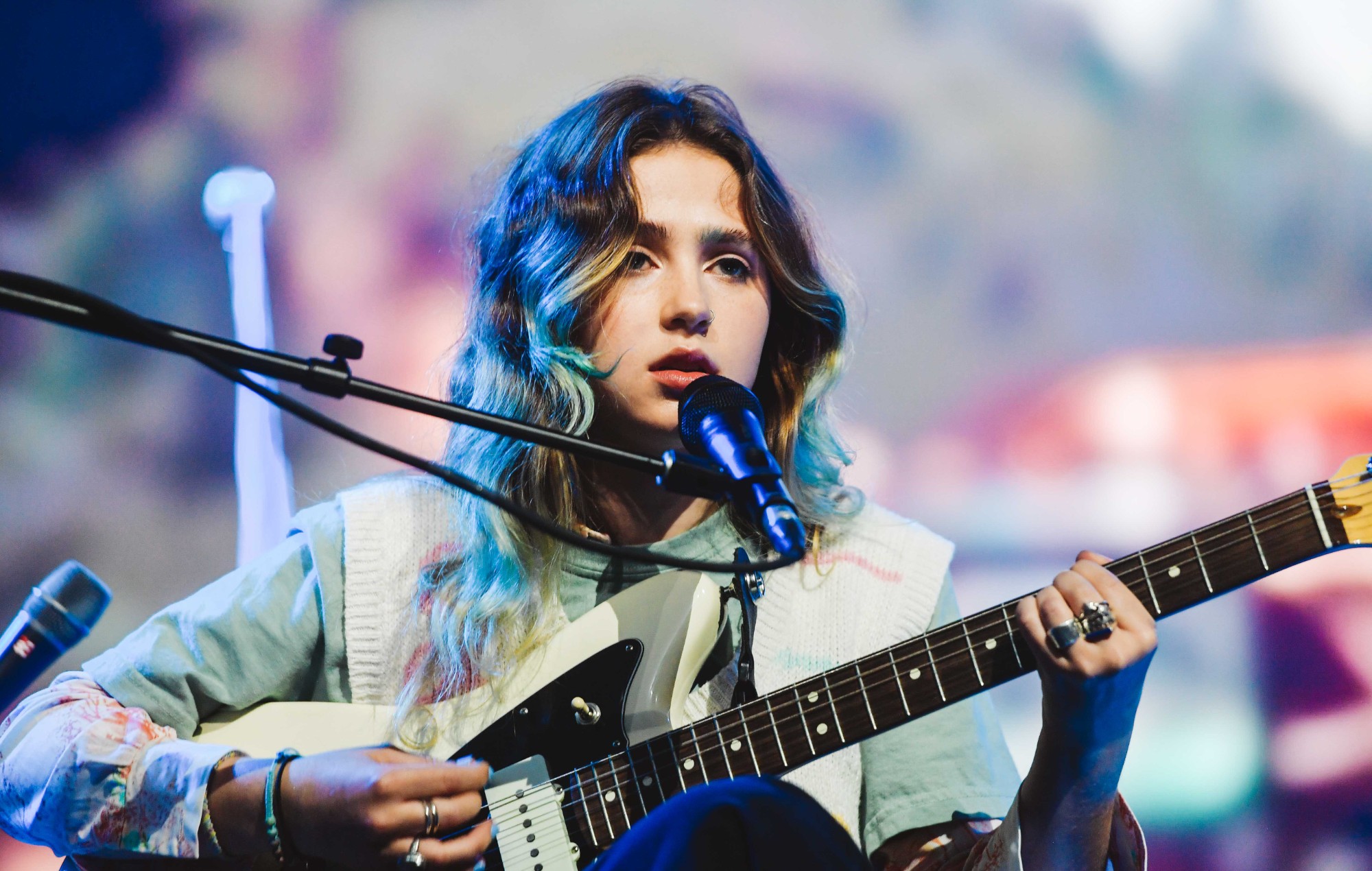Clairo performing live with an electric guitar HD Wallpaper