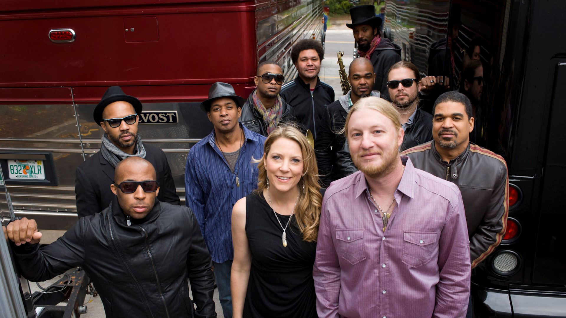 Tedeschi Trucks Band posing with their tour bus HD Wallpaper