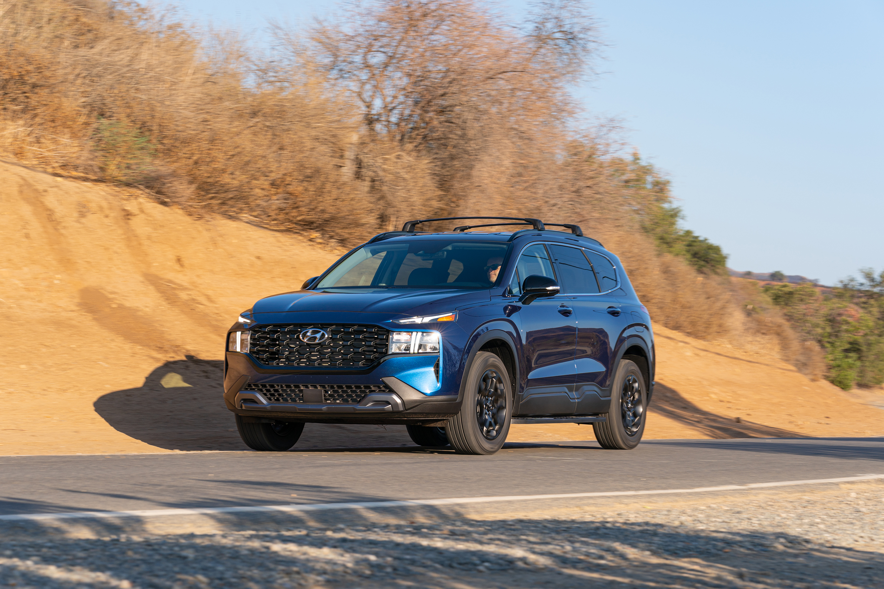 Blue 2022 Hyundai Santa Fe XRT SUV on a sunny road HD Wallpaper