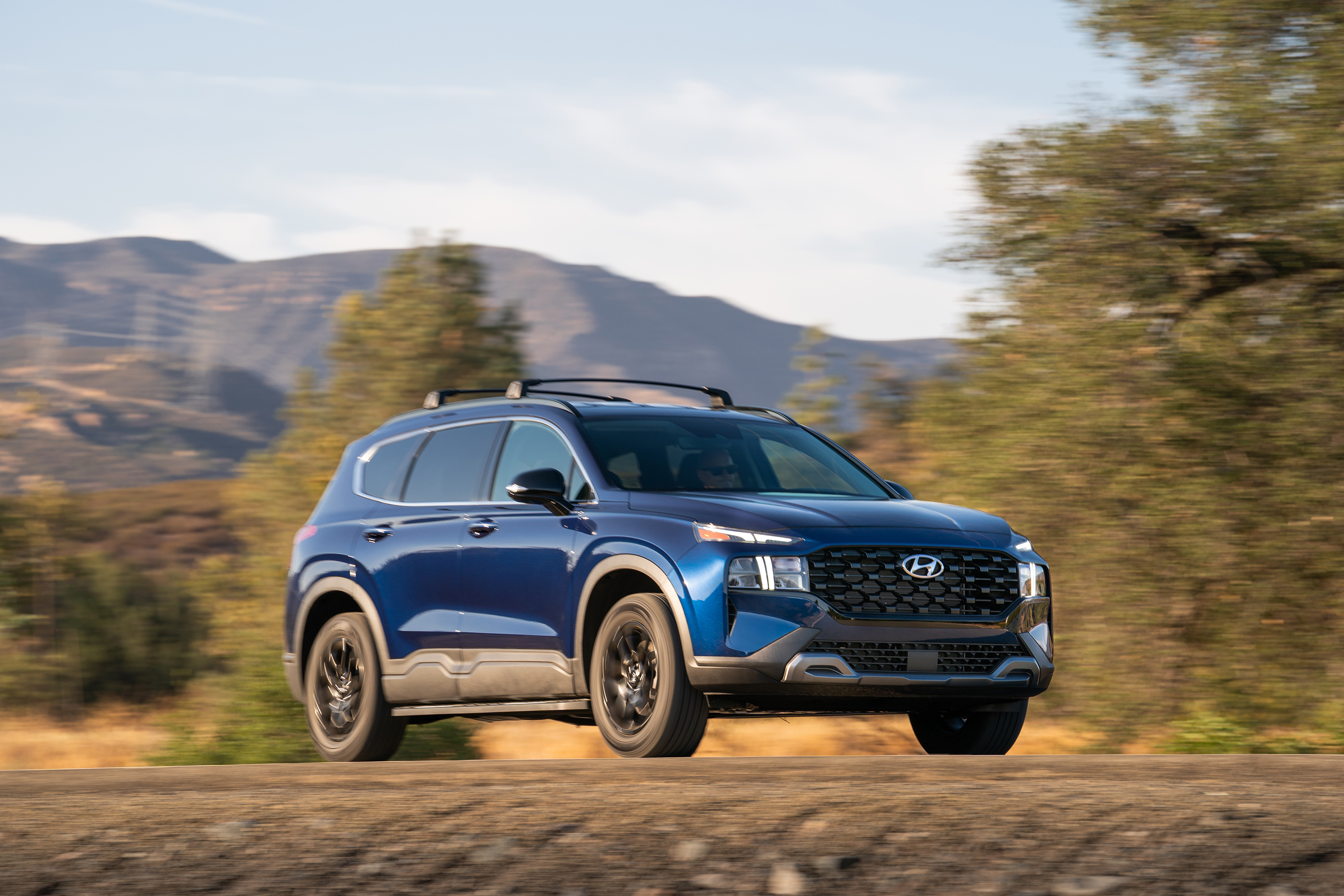 Blue 2022 Hyundai Santa Fe XRT SUV in motion HD Wallpaper