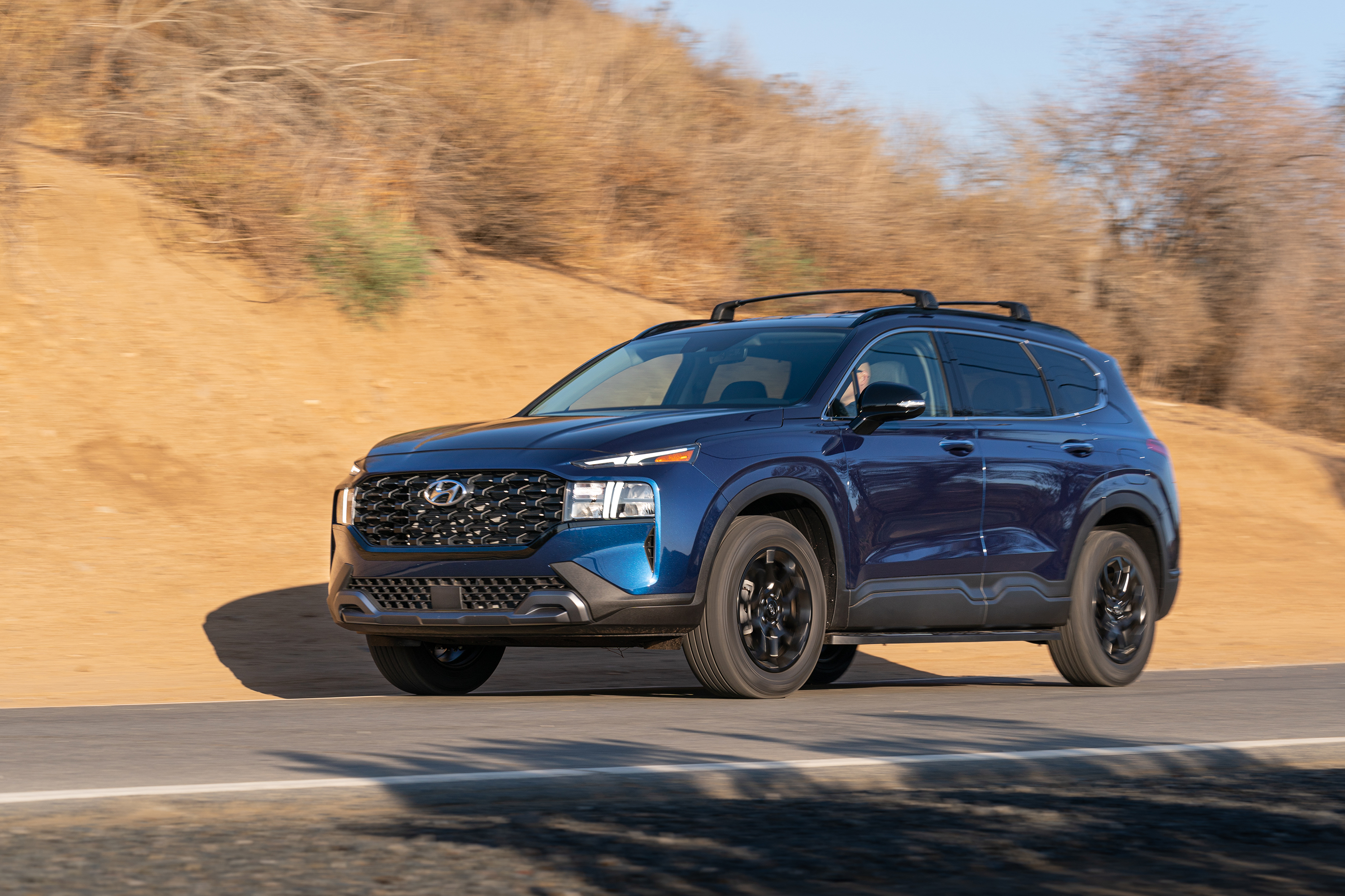 Blue 2022 Hyundai Santa Fe XRT SUV driving on road HD Wallpaper