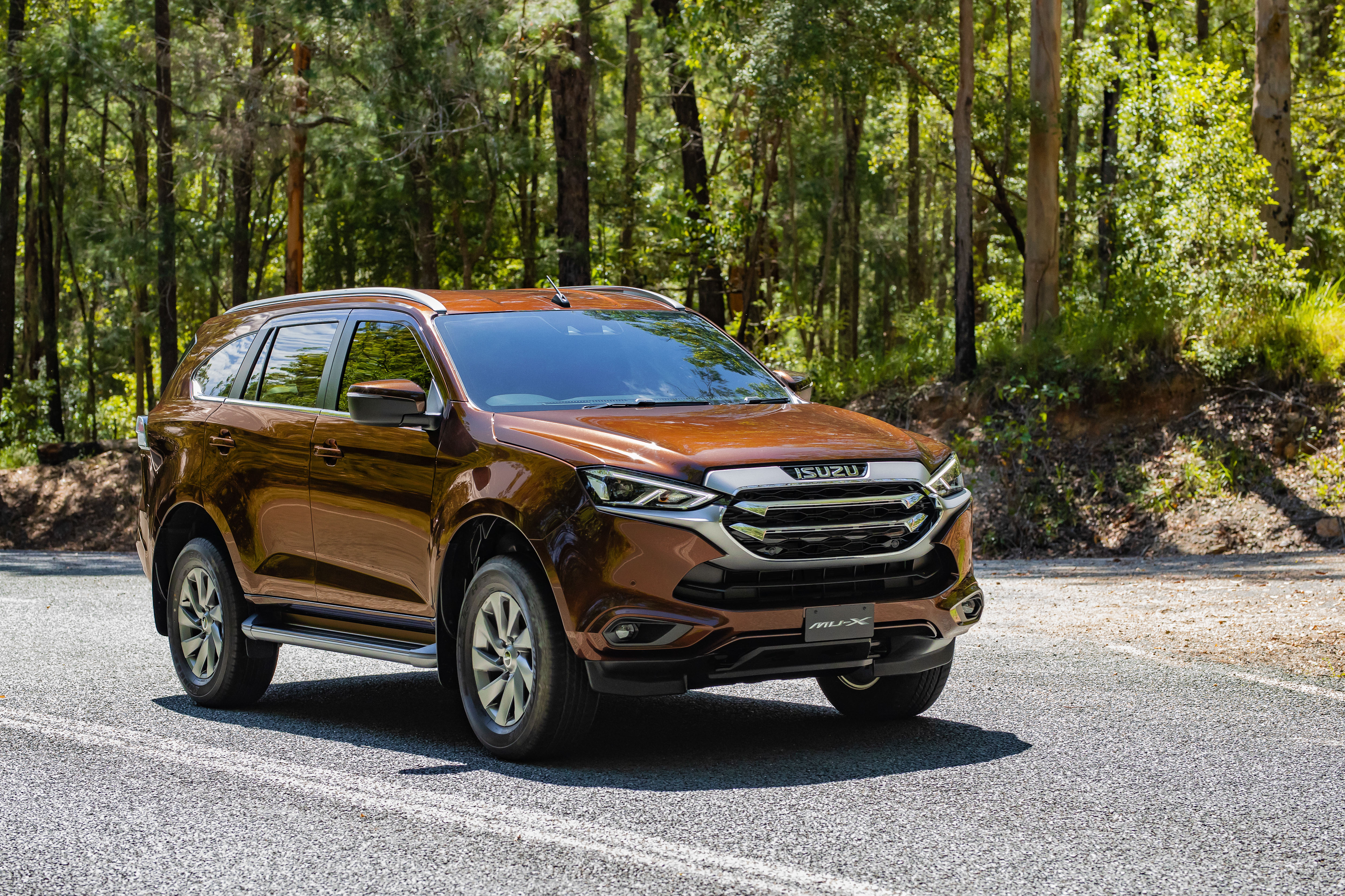 Isuzu MU-X 4x4 LS-U SUV on a forest road HD Wallpaper