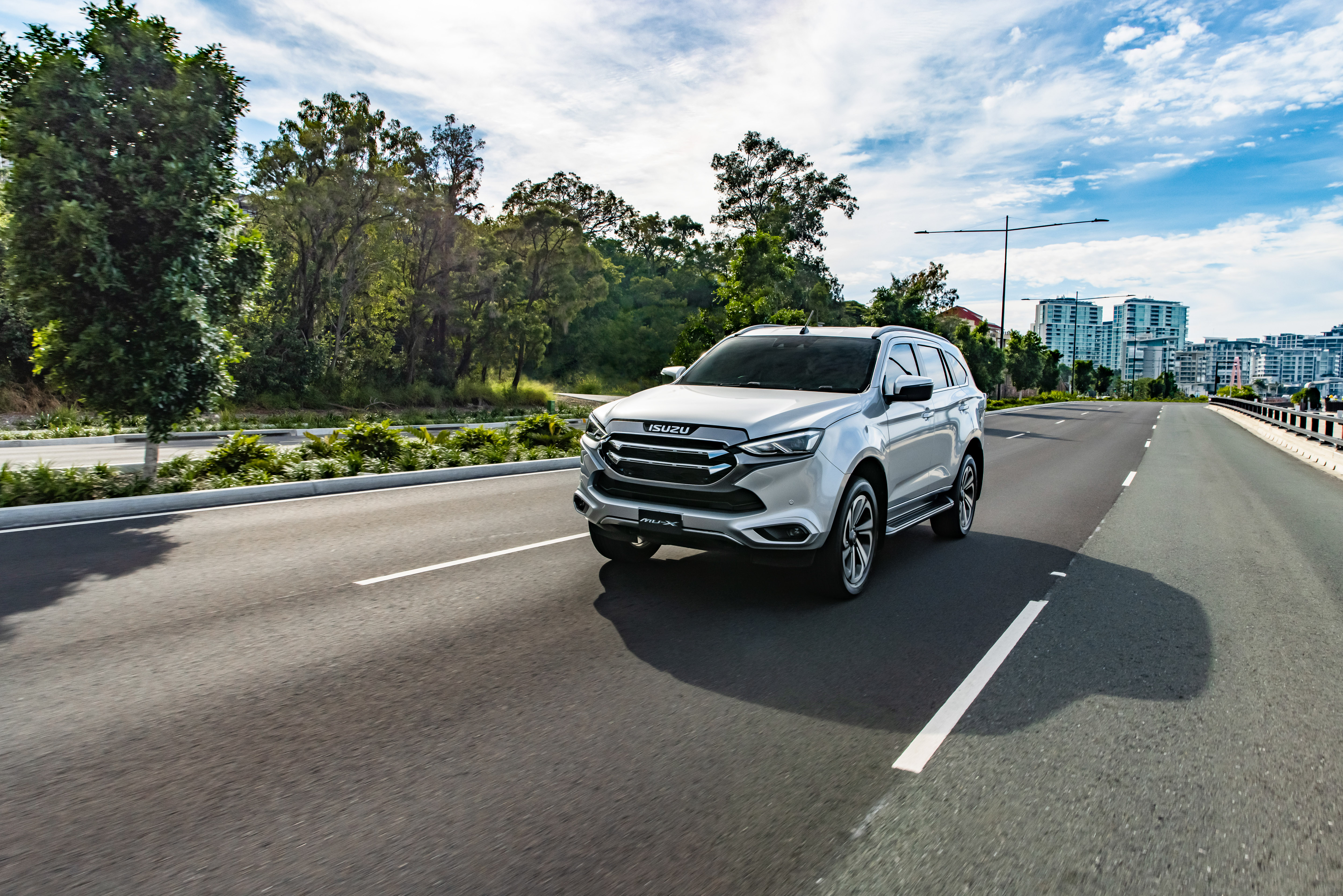 Isuzu MU-X 4x4 LS-T SUV driving on a road HD Wallpaper