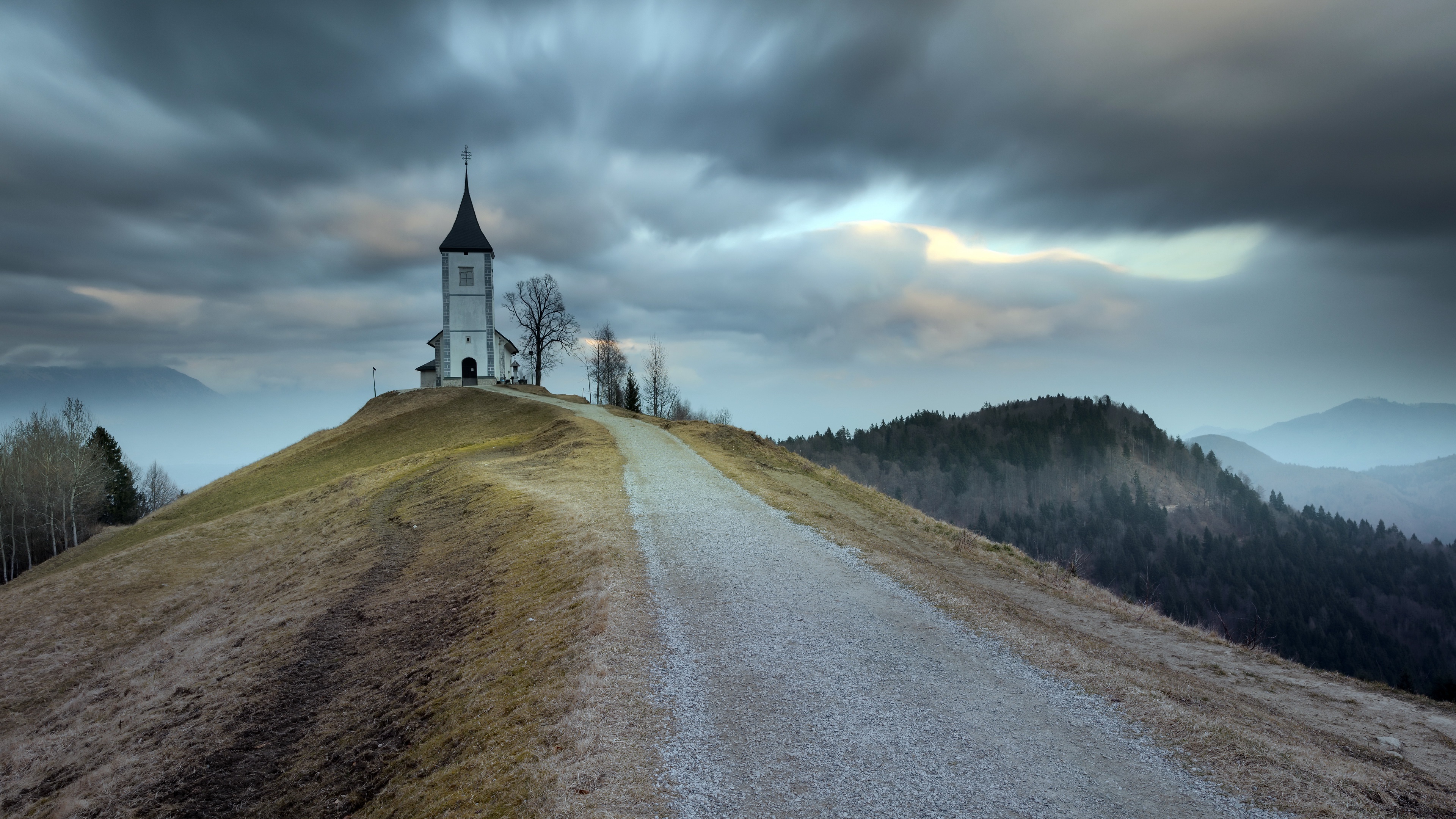 Slovenia's Jamnik Church under a Dramatic Sky HD Wallpaper