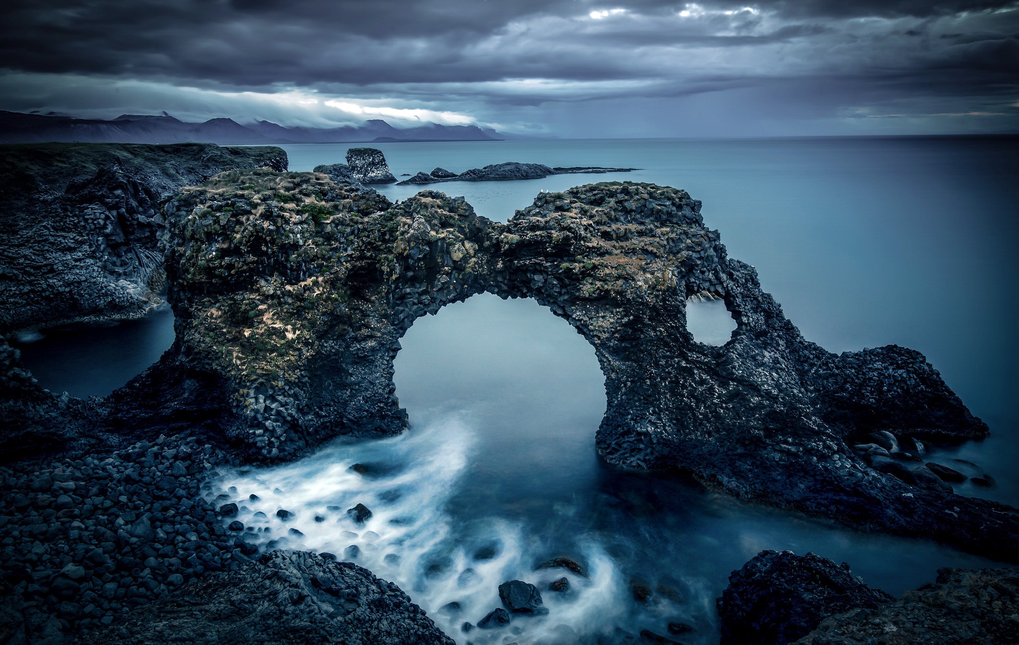 Dramatic Coastal Rock Arch over Smooth Water HD Wallpaper