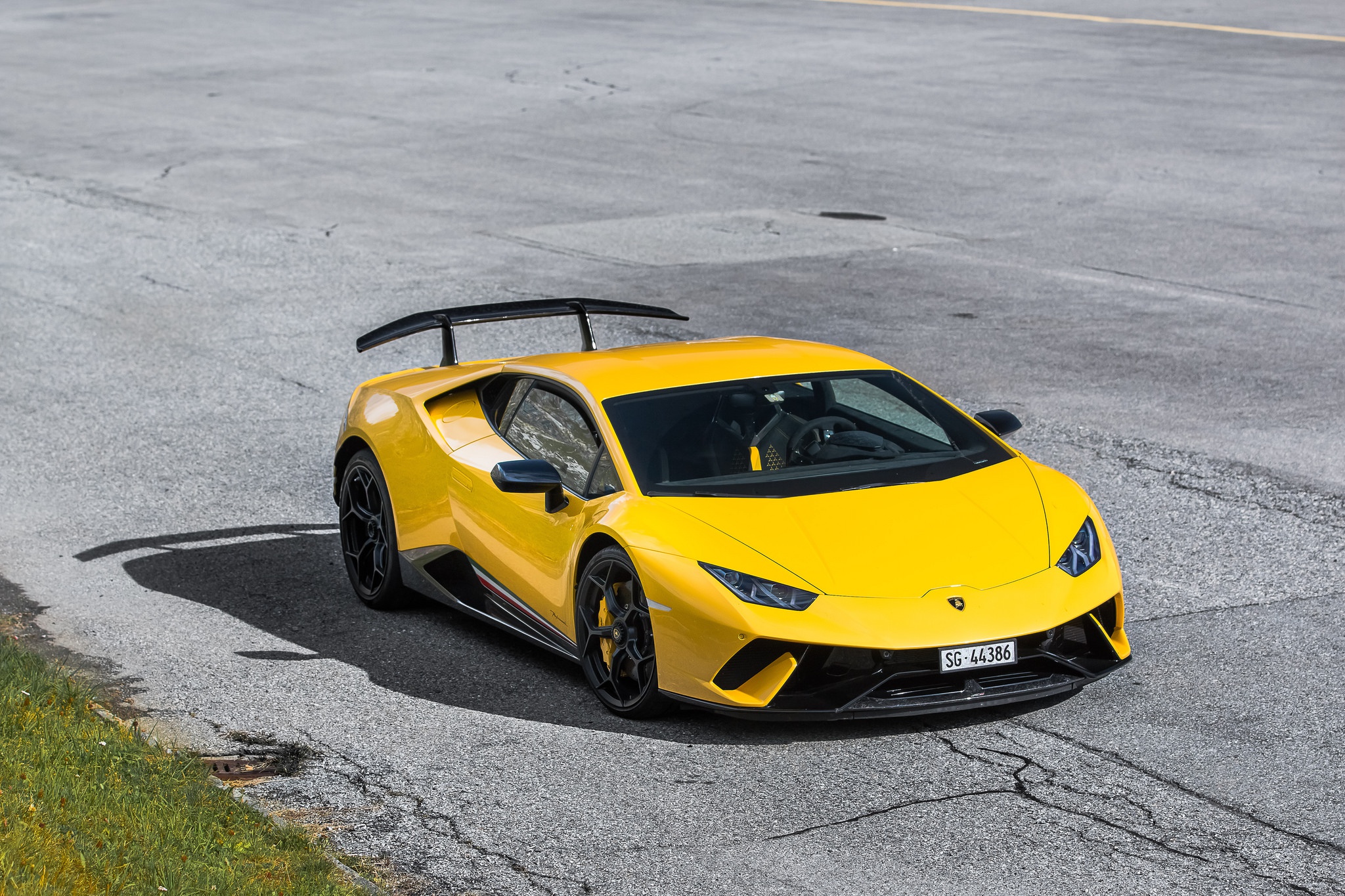 Yellow Lamborghini Huracán Performanté on asphalt road HD Wallpaper