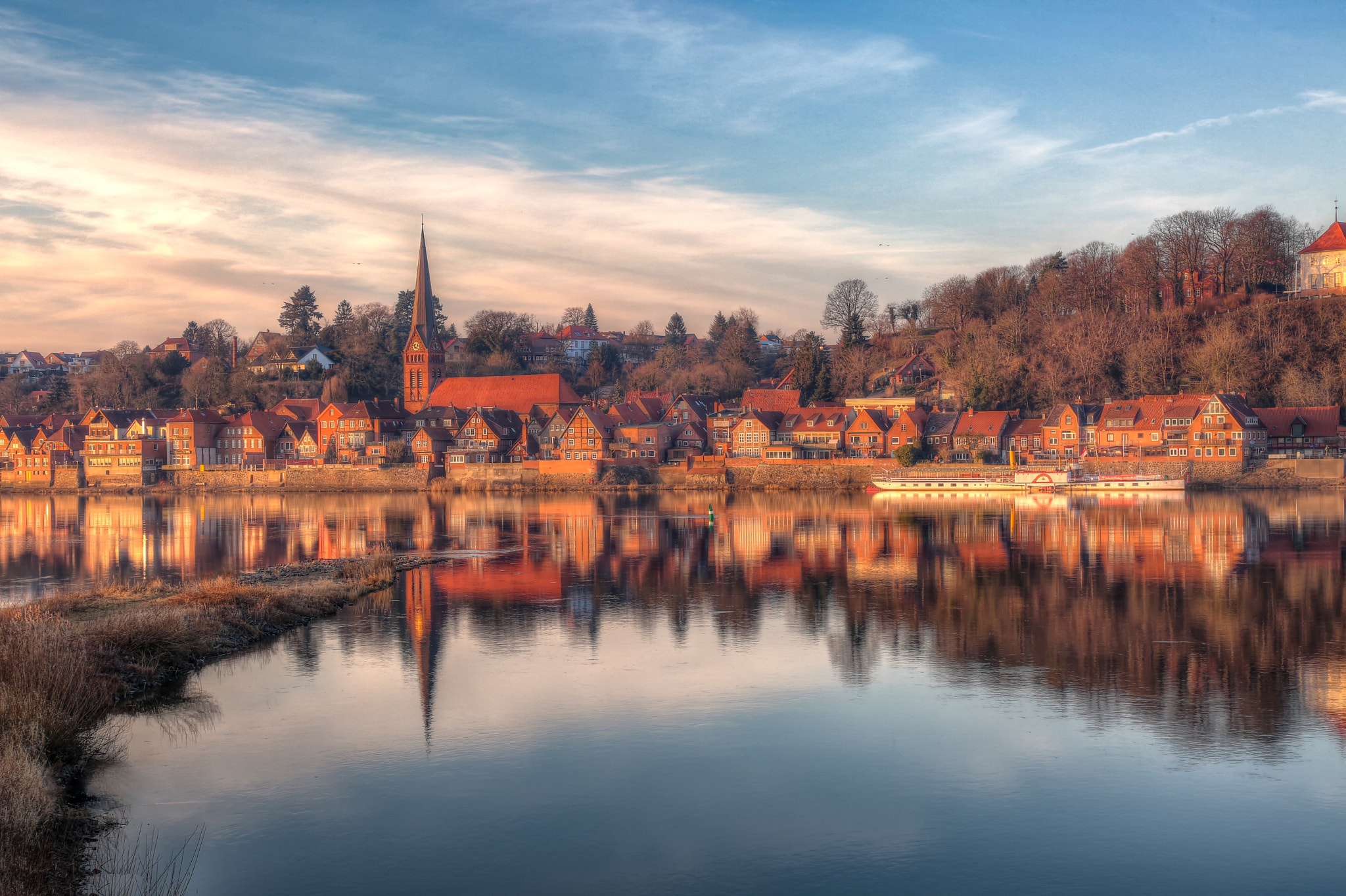 Town Reflected in River at Sunset HD Wallpaper
