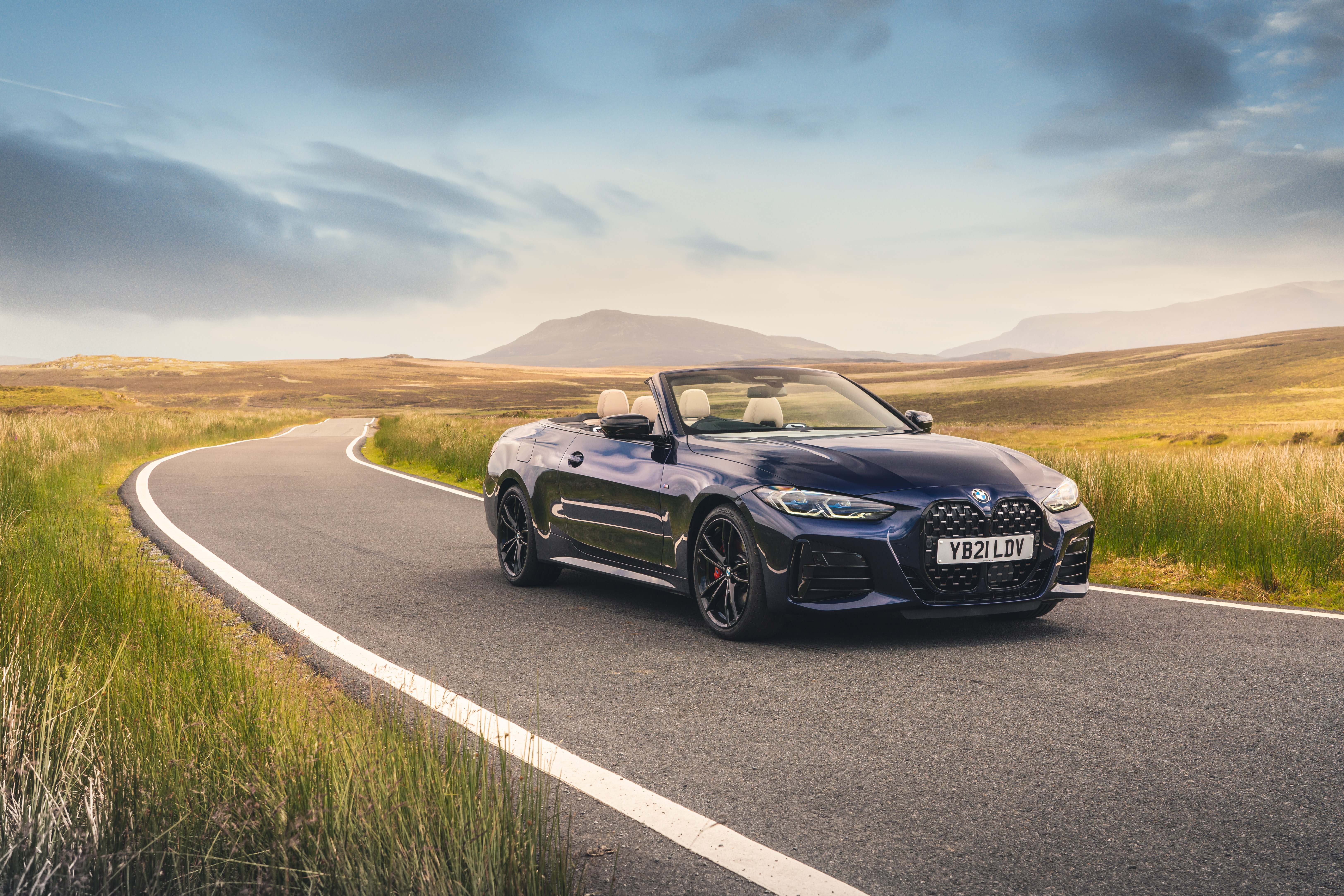 BMW M440i xDrive Cabriolet on a beautiful country road HD Wallpaper