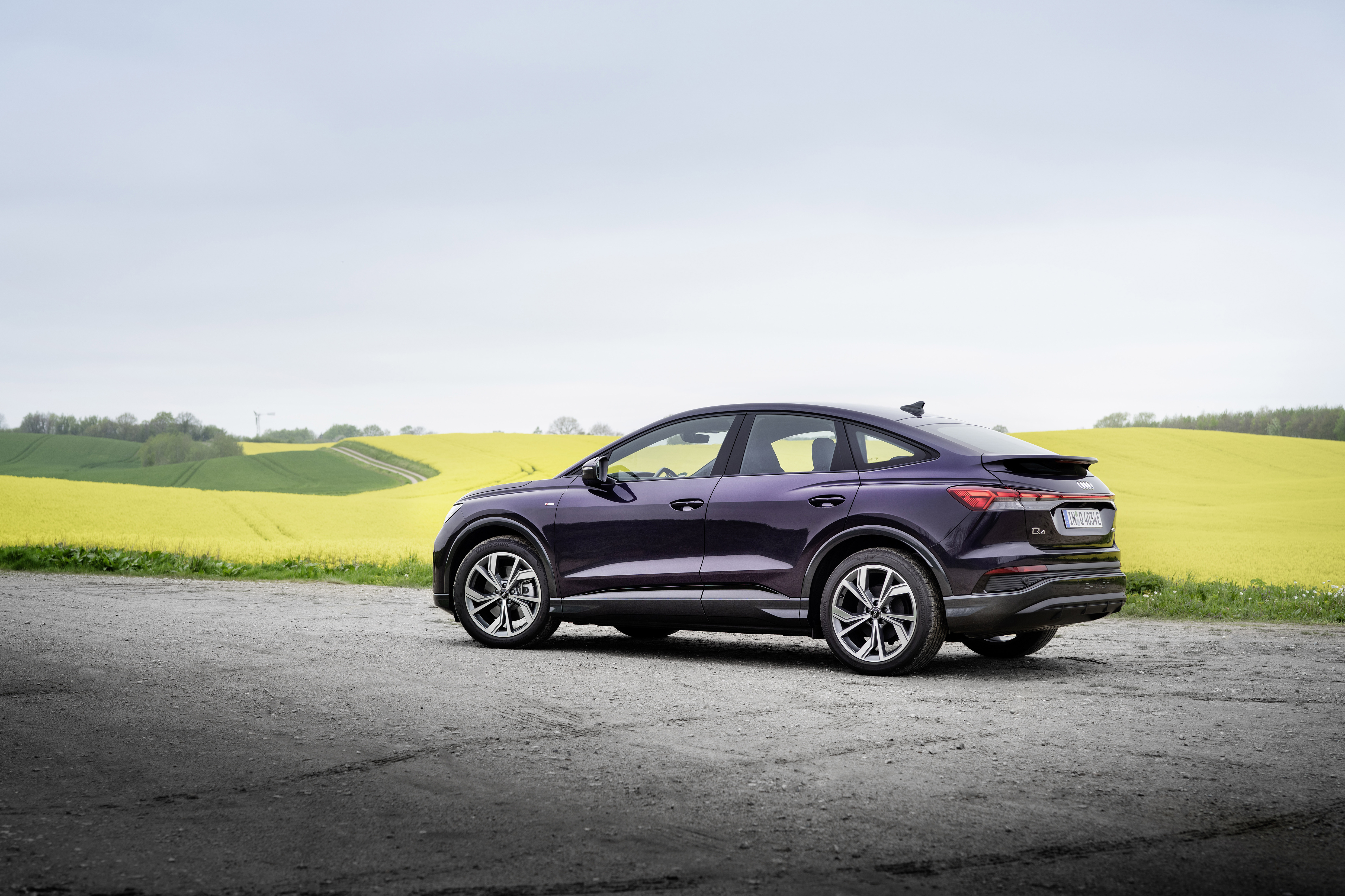Purple Audi Q4 Sportback e-tron SUV by yellow field HD Wallpaper