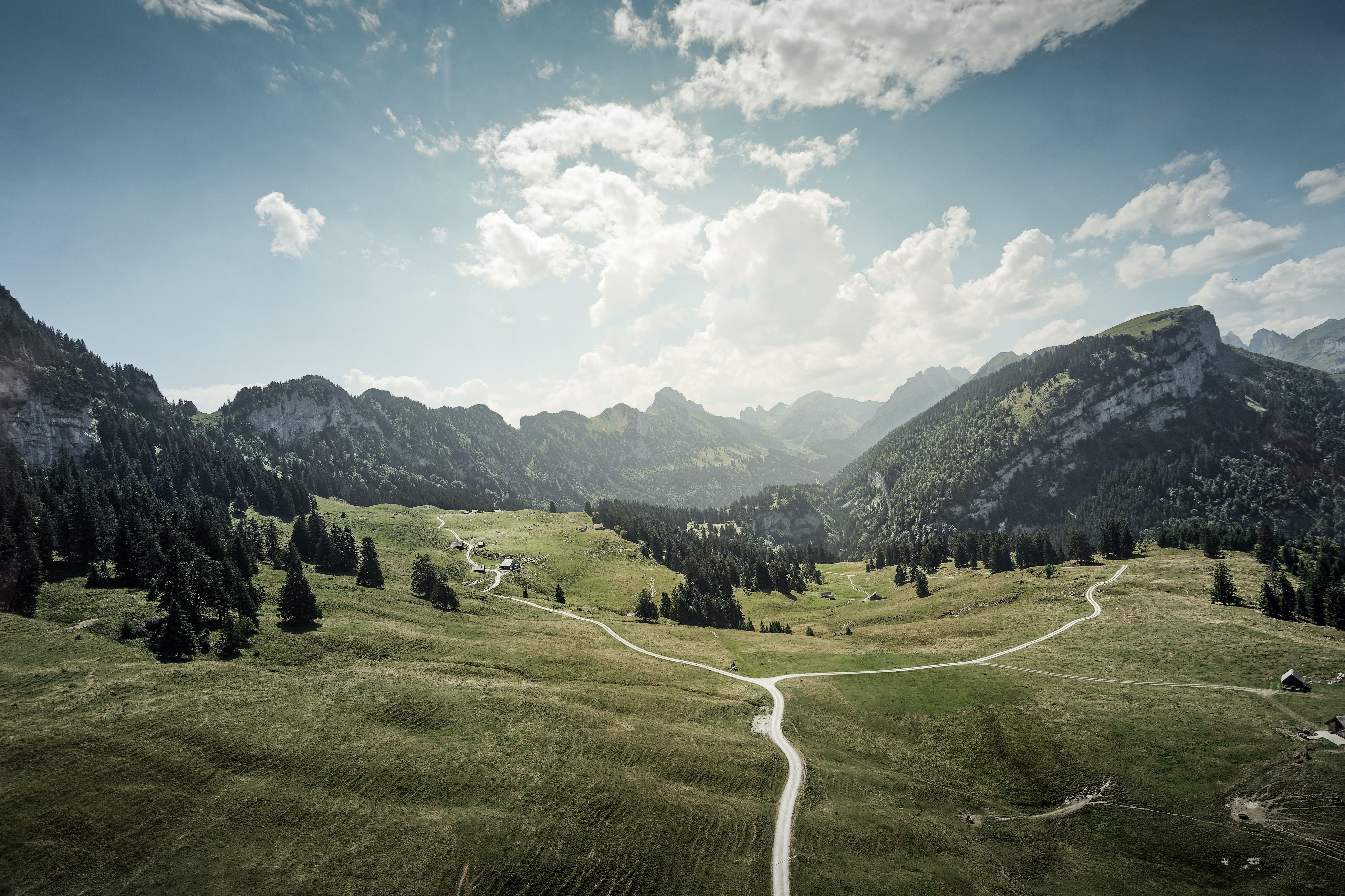 Winding Road through Green Mountain Landscape HD Wallpaper