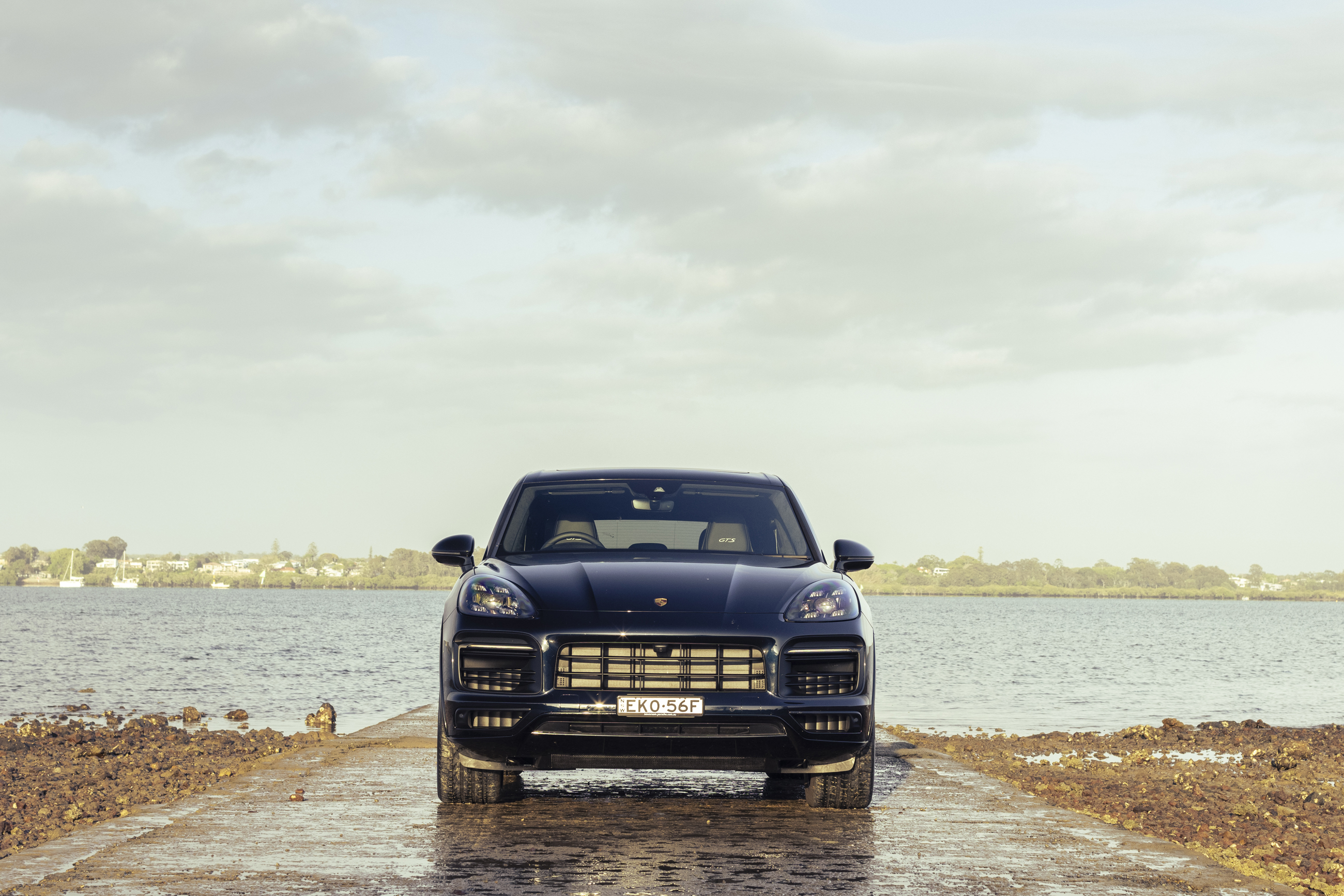 Black Porsche Cayenne GTS SUV by the water HD Wallpaper