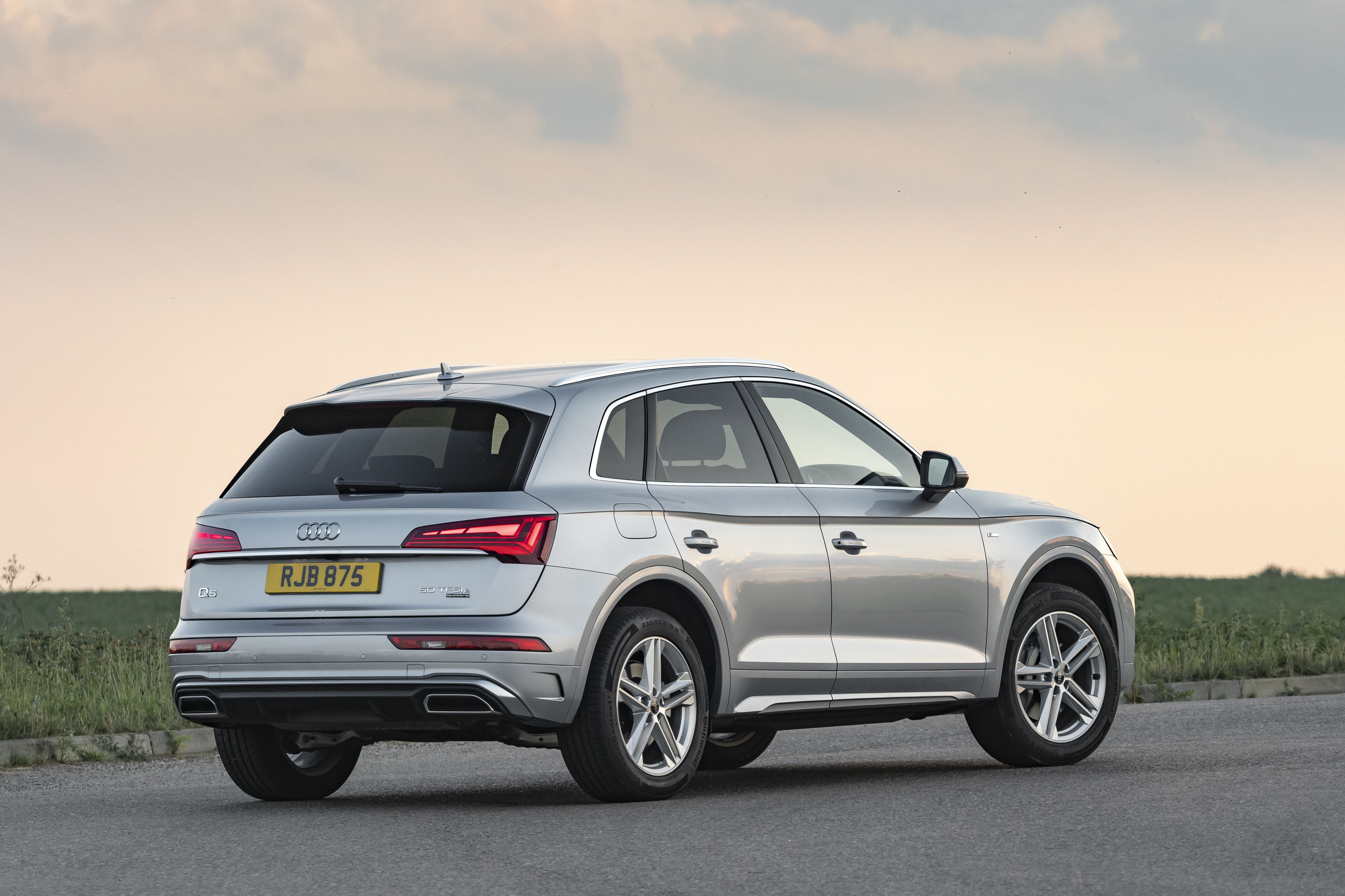 Silver Audi Q5 SUV parked on an asphalt road HD Wallpaper